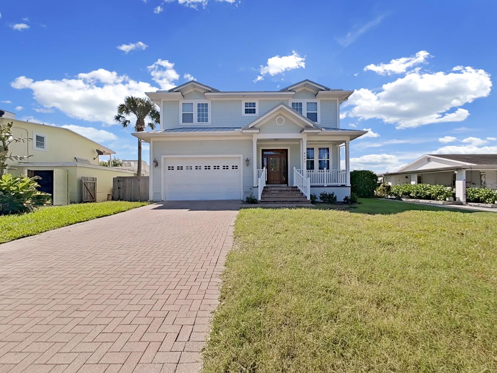 This stunning and elegantly designed Key West style home, built in 2005, offers the ultimate in both entertainment and outdoor enjoyment. Ideal for boating, kayaking, paddle boarding, or simply relaxing with a beverage while awaiting the next manatee sighting, this property provides an exceptional waterfront lifestyle. Upon entering, you are greeted by formal living and dining areas. accentuated by 10-foot ceilings, gleaming hardwood floors, modern paint hues, and abundant natural light. The gourmet kitchen is a chef's dream, featuring 42" mahogany cabinetry, granite countertops, a gas range, double ovens, and a work station with an eat-in area that overlooks the water. The family room and office boast impressive 180-degree canal views. The second floor offers four spacious bedrooms, three full baths, and an oversized laundry room. The master suite is a true retreat, with a custom mega closet, dual vanities, a jetted tub, and a separate shower. The outdoor area is equally impressive, featuring a covered porch that overlooks an expansive patio designed for outdoor entertaining. A luxurious pool and spa, integrated seamlessly into the landscape, provide a perfect place to unwind. Additionally, the private dock enhances the waterfront experience, with only ten properties between you and the open bay. This home offers a perfect balance of indoor and outdoor living on Flamingo. Experience the best of South Tampa waterfront living at an exceptional value.