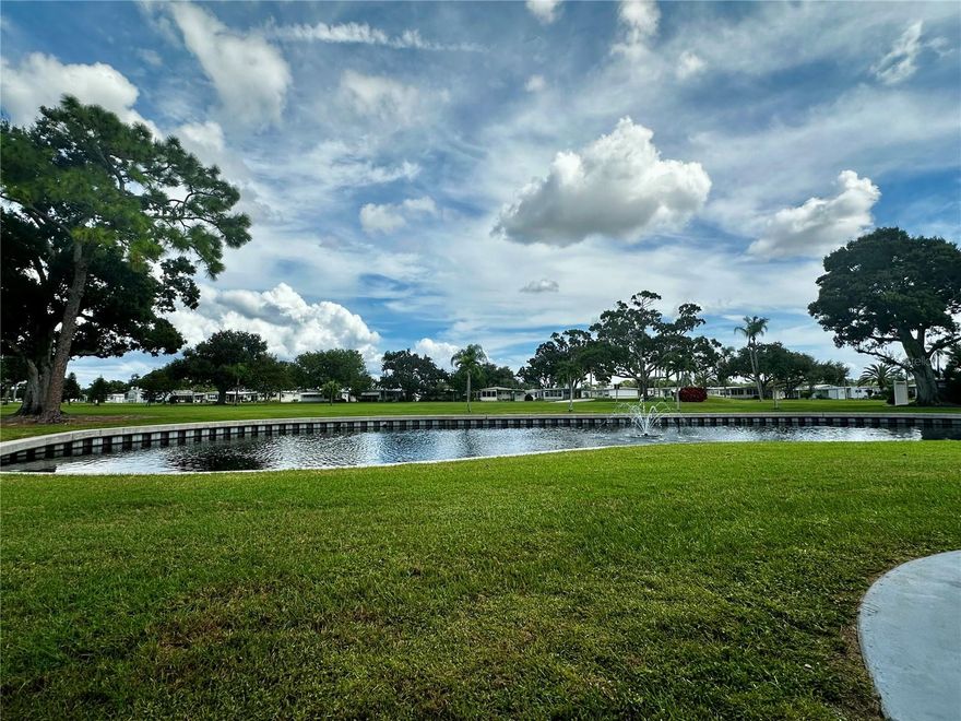 This stunning home by the 5th tee box of the Fairway Village golf course, and is ready for it's new owner. The 2 bedroom 2 bath home, screams elegance. It's floor plan has been lovingly updated boasting, newly redesigned open floor plan to showcase renovated kitchen, high end flooring through out. Freshly painted and filled with natural light, the open kitchen plan flows easily into the dining and living room areas. Need more storage? You'll find it here, with built-ins to house for all those extra winter clothes you brought to Florida but will rarely wear. Enjoy your down time relaxing in the sun on the outdoor patio, or the bright and airy Florida room. This fully furnished home includes washer & dryer, new large water heater and AC in 2022.  The kitchen is fully loaded with dishes, pots pans and kitchen supplies. Relax in the new cozy living room furniture with club chairs and oversized sofa. Plenty of room welcome your guests. The oversized he/she shed with washer & Dryer, has lots of storage space, built in shelves, room for a work bench, and has a water tub for washing off all the grime. Fairway Village is a spacious, premier manufactured home community. A perfect place to live your dream, whether you stay year-round or spend some months elsewhere. A 100 percent Resident Owned Manufactured Home Community of 751 homes for persons 55-plus years of age. Located in sunny Largo, on Florida's Gulf coast and close to many of Florida's major attractions. We offer a feeling of spaciousness with our wide curbed streets with streetlights and sidewalks. All homes are located with established setbacks from the street. Amenities include: A private 9 hole par 3 golf course with two lakefront fairways and a practice putting green A five-plus acre lake for catch and release fishing Two swimming pools with hot tubs Eight sheltered shuffleboard courts A new 19,000+ sq. ft. Clubhouse was completed January, 2022, that includes the following: 700 seat Auditorium/Ballroom, Large commercial kitchen, Stage for chorus and programs, Separate conference rooms, Fitness center, Library, Billiard room, Card playing room, Sitting areas, Wi-fi service throughout. Fairway Village's 2025 maintenance fee of $401/month includes water, sewer, in-home high speed internet access, 220+ Spectrum cable TV channels, curbside trash pickup, lawn pest control and lawncare. 2025 Annual Golf memberships are available to residents for  unlimited play. Non-members pay a $15 greens fee during season and $8 off season. The Fairway Village Social Committee (FSC) promotes and coordinates over 50 social activities. While the listing information is deemed reliable, please note, it is not guaranteed and should be independently verified for accuracy.