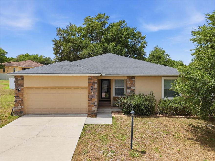 Welcome to your DREAM Home in Lady Lake, Florida, a rare gem near Spanish Springs!! Discover the perfect blend of space and serenity in this meticulously maintained 2015 built home, situated in a quiet, quaint community. This property boasts 1/3 acre lot, offering an expansive backyard retreat fully enclosed by privacy fencing. The grounds are anchored by Majestic, Mature Oak trees, providing a natural canopy and a peaceful "Old Florida" feel that is increasingly hard to find! Inside, the thoughtfully designed floor plan features four spacious bedrooms! Plenty of room for a home office, hobby space, family living or hosting guests! Enjoy the ultimate convenience of being just minutes away from the vibrant Spanish Springs Town Square in The Villages. Nature lovers will enjoy Snooky Park walking trail and recreation area, as well as Veterans Park! Enjoy the Best of both worlds, the vibrant energy of Spanish Springs and the quiet serenity of nature trails!  You'll have world-class dining, nightly live entertainment, and boutique shopping right at your fingertips while retreating to your private sanctuary at the end of the day!  The Upgrades featured: NEW CARPET in the Primary Bedroom, HOME SOFTENER SYSTEM, IRRIGATION CONTROL, SAMSUNG APPLIANCES, GE WASHER/ DRYER, and OAK TREES TRIMMED/THINNED.  Schedule your private tour today to experience this unique lifestyle for yourself!