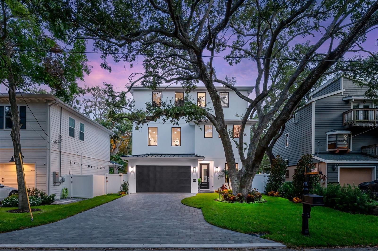 Just moments from the iconic Bayshore Boulevard, this custom-built, three-story luxury pool residence offers just under 3,000 square feet of thoughtfully designed living space, featuring three spacious bedrooms, three and a half bathrooms, and a two-car garage. Meticulously crafted with timeless attention to detail, the home showcases white oak engineered hardwood flooring, Level 5 wall finishes, and oversized impact-rated windows that fill each level with natural light. The first floor includes a private guest suite with an en-suite bath and walk-in rain shower—perfect for visitors or multigenerational living. Upstairs, the second floor unveils an open-concept layout that seamlessly connects the living room, dining area, and a true entertainer’s kitchen. Enjoy waterfall-edge Taj Mahal quartzite countertops, soft-close cabinetry, a GAS cooktop, top-of-the-line LG appliances, an oversized bar fridge, and a double oven/microwave combination. A stylish half bath adds convenience to this main living space. On the third level, you’ll find two expansive bedrooms, each featuring custom walk-in closets and spa-inspired en-suite bathrooms with rain showers and high-end granite countertops. A large laundry room completes this floor. For added ease, a private elevator services all three levels. All bathrooms throughout the home feature luxurious granite countertops and modern rain showers, elevating everyday living with high-end comfort. Step outside to your own backyard oasis—designed for both relaxation and entertainment. The outdoor retreat includes lush turf, a covered patio, a resort-style pool with WiFi-enabled controls that allow you to heat or cool the pool remotely, and custom landscaping and lighting. Additional upgrades include a durable metal roof, epoxy-coated garage floor, a tankless water heater, and two electric vehicle charging outlets in the garage. The driveway is finished with elegant pavers, enhancing the home’s curb appeal. This home also comes with a 2-10 builder warranty and is located in Flood Zone X, meaning no flood insurance is required. Situated in the heart of South Tampa—just minutes from Hyde Park Village, Downtown Tampa, and some of the city’s best dining, shopping, and recreation—this one-of-a-kind home blends luxury living with an unbeatable location. ***Bonus: Seller is offering $10,000 towards the buyer’s closing costs.***