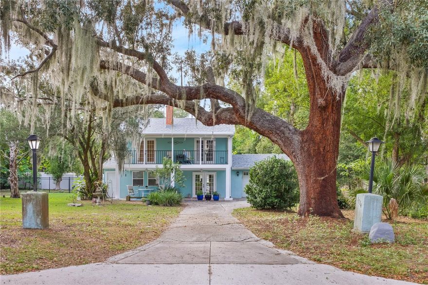 Welcome home! This charming two-story home sits right in the heart of Eustis. You will know you have found the right spot when you pull in under the beautiful oak tree and down the long driveway. The French doors off the patio open right up into the newly remodeled dining room and kitchen. The fresh paint and new vinyl flooring give this 1946 home a modern touch. The kitchen features spacious granite countertops and new appliances. The dining room opens up to the living room complete with a fireplace and full bathroom for your guests. The stairs lead to the three bedrooms. The master bedroom features wood flooring and French doors that lead out to the second floor balcony. You really have to see this view! Bedroom two also has wood floors, 2 closets and French door that lead out to the second floor balcony. The third bedroom and the rest of the upstairs are carpeted. The fenced in spacious backyard gives a lot of room to meet your needs. The air conditioner is 4 years old. The gas hot water heater and the roof are new! Do not let this beautiful home pass you by. It will not last for long!