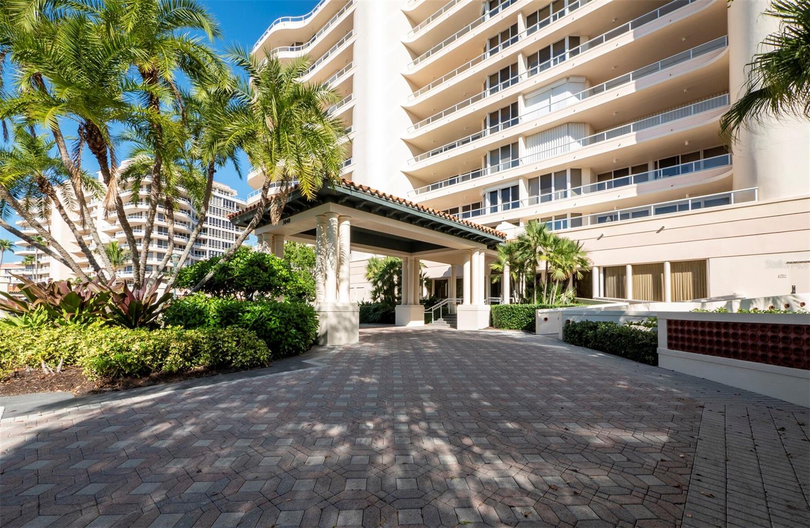 Set above the sparkling waters of Sarasota Bay, this beautifully updated 3BR/3.5BA, 2,550 sq. ft. residence in Grand Bay on Longboat Key offers refined living with a seamless, well-planned layout. From the moment the private elevator opens to your foyer, the atmosphere feels bright and balanced, with rich wood floors, crown molding and recessed lighting framing panoramic views of the bay, Harbourside golf course and pond. The spacious living room opens to an expansive terrace overlooking the water, while the formal dining area provides a graceful space for entertaining. The reimagined kitchen combines form and function with all-white cabinetry, stone countertops, stainless-steel appliances and a breakfast bar. A flexible third bedroom—with custom built-ins and terrace access—can also serve as a private office or sitting room. The primary suite is a peaceful retreat with terrace access, a large walk-in closet, and a luxurious bath featuring dual vanities, soaking tub, glass-enclosed shower and bidet. Additional highlights include a laundry room and one covered parking spaces. Grand Bay residents enjoy resort-style amenities including two pools, a clubhouse, fitness center, tennis courts, and deeded beach access through the private Bay Isles Beach Club for exclusive Gulf-front enjoyment.
