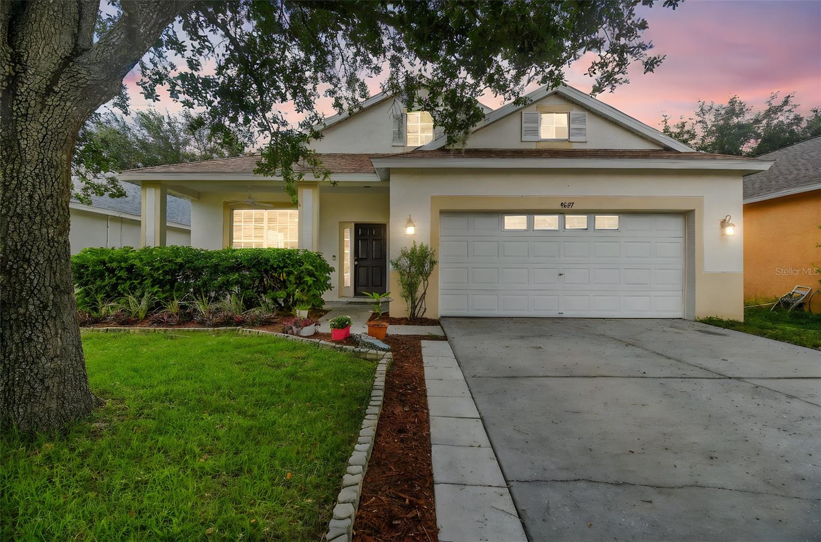 Move-in ready and beautifully maintained, this 3-bedroom, 2-bathroom home in New Port Richey features an open floor plan with ceramic tile throughout the main living areas and brand-new carpet in the bedrooms (June 2025). The spacious kitchen is perfect for entertaining, and the freshly painted interior enhances its bright, welcoming feel. Enjoy peace of mind with a brand-new roof (May 2025) and a well-maintained 2016 AC system. Relax on the covered patio overlooking a tranquil yard shaded by mature trees. Situated in a quiet, friendly neighborhood close to top-rated schools, shopping, restaurants, and all that Florida living offers. No work needed—just move in and enjoy! Schedule your private showing today.