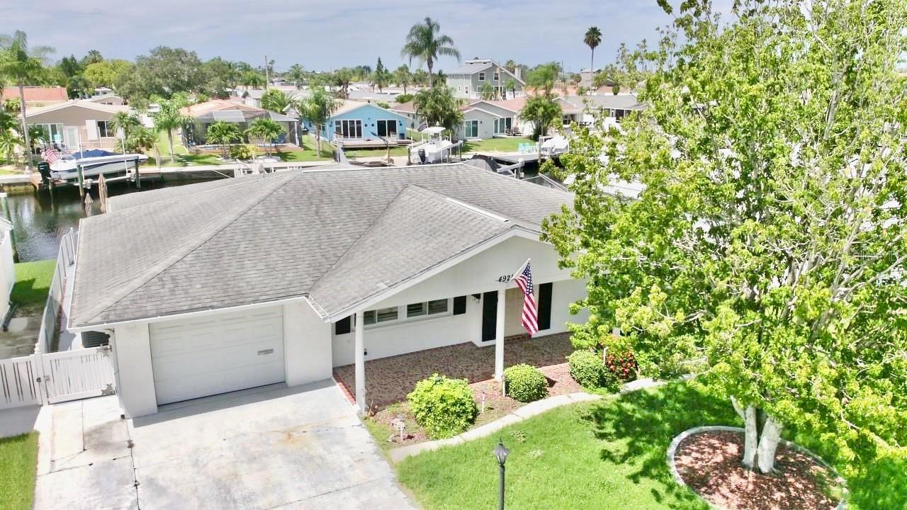 YOUR NEW WATERFRONT OASIS AWAITS!! THIS 3 BEDROOM 2 BATHROOM OPEN FLOOR PLAN COMPLETELY REMODELED HOME SITS ON A DEEP WATER CHANNEL LOT WITH EASY ACCESS TO THE OPEN WATER OF THE GULF OF AMERICA!!!! STEP OUTSIDE AND GO OFFSHORE FISHING, SCALLOPING, OR TAKE A TRIP TO THE ISLANDS JUST A MILE OFF THE COAST!! LIVING IN GULF HARBORS COMES WITH ACCESS TO THE PRIVATE COMMUNITY BEACH AND IS SITUATED MINUTES FROM GROCERY STORES, SHOPPING, AND DOWNTOWN NEW PORT RICHEY WITH RESTAURANTS, BARS, AND UNIQUE LOCAL SHOPS GALORE. THIS HOME HAS AN OPEN FLOOR PLAN WITH ALL THE HIGH END FINISHES YOU COULD WANT IN A WATERFRONT HOME WITH LUXURY STONE COUNTERS THROUGHOUT, CUSTOM LIGHTING, UNIQUE LOW MAINTENANCE FLOORING, AND RESORT STYLE BATHROOMS. ENJOY THE SUNSETS WHILE SITTING ON YOUR DOCK AND SEEING THE DOLPHINS AND BIRDS PLAY. THIS AFFORDABLE WATERFRONT HOME IS PERFECT FOR A PERMANENT OR SEASONAL RESIDENT SO MAKE YOUR APPOINTMENT TODAY