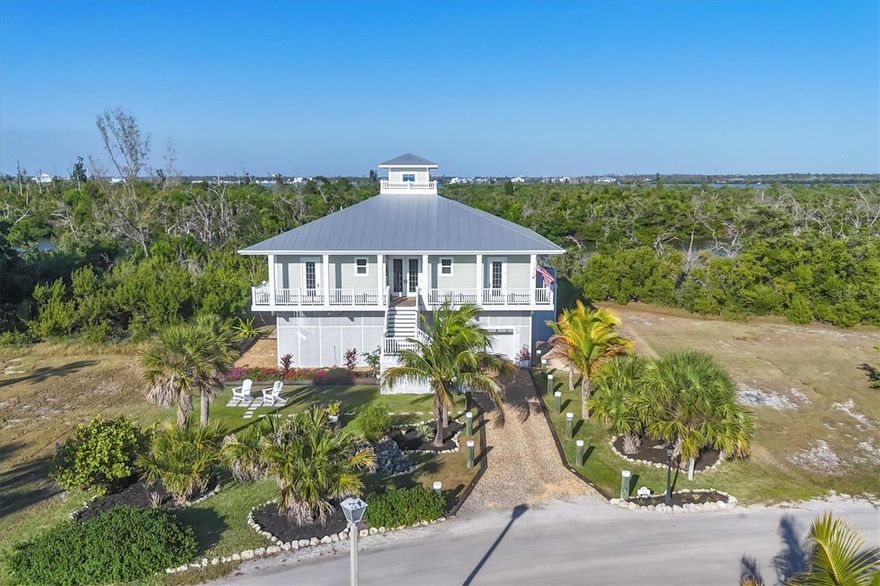 3BR • 2BA • 2017 Custom Home • Palm Island Resort
Beautifully crafted 2017 custom home in the gated, golf-cart community of Palm Island Resort in Placida, FL. Features include soaring ceilings, crown moldings, custom cabinetry, tiger-wood flooring, and abundant natural light. Home is in pristine, move-in condition with hurricane-rated doors and windows. The open floor plan flows to a 12' x 55' screened lanai overlooking a large backyard and Knights Bay. Gourmet kitchen includes a 48" Sub-Zero refrigerator, Conestoga cabinetry, granite counters, induction oven, and custom bar. Bedrooms feature plantation shutters and oversized closets; the primary suite offers a large walk-in closet, luxury bath, and French doors to the lanai. Additional amenities: indoor enclosed elevator, spacious laundry room, golf-cart garage with storage, and outdoor rinse shower. Walking distance to tennis & pickleball courts, pool, clubhouse, and fitness center, plus deeded access to two miles of private beach. Assumable mortgage at an excellent fixed rate available to qualified buyers.