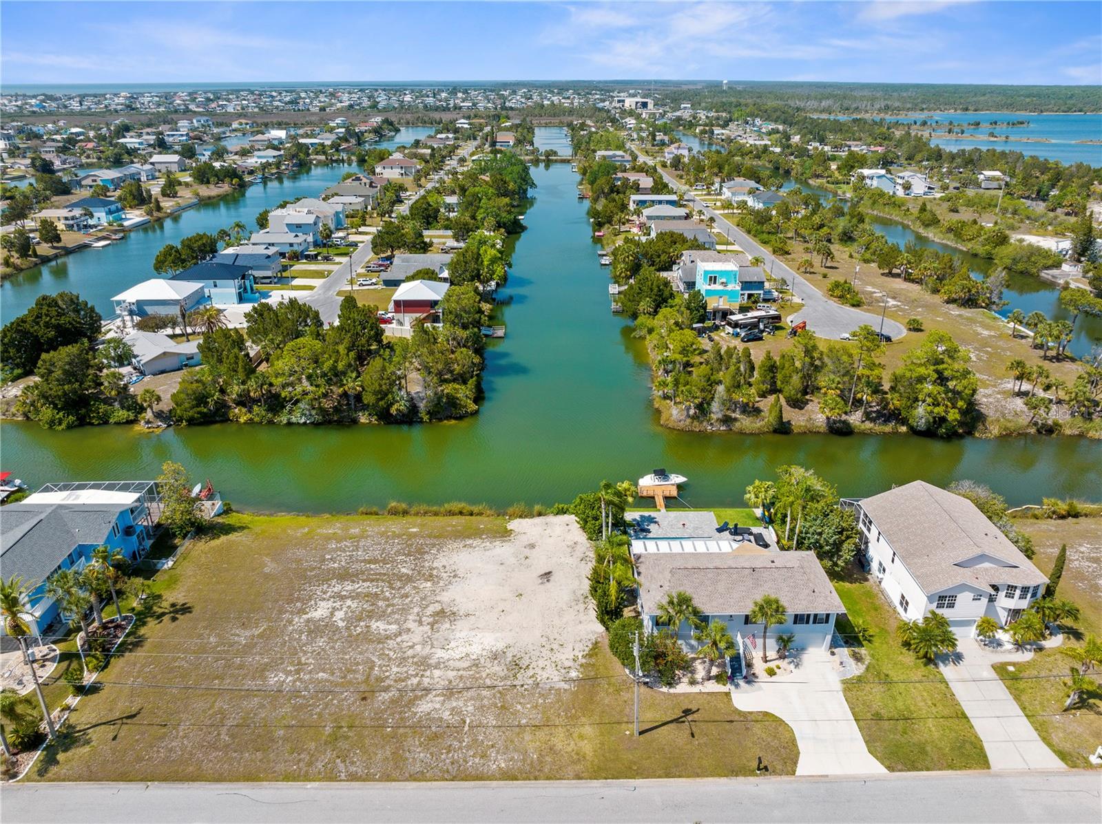 Beautiful waterfront Lot with NO Rear Neighbors looking down the canal. Nothing but Views of the Water!!
Located in Hernando Beach South, this lot offers 75 feet of water and road frontage and is nearly 125 ft deep.
The lot faces North and offers indirect access to the Gulf of Mexico by using the Community Boat Lift. The
HOA is low $306/year and your grounds maintenance is included until you break ground. This lot is larger than
most in the community. There are many local restaurants that can be accessed by golf cart or bike. Linda
Pederson Park, Jenkin's Creek and Roger's Park are right up the road. In a few more minutes, you can be at
the Weeki Wachee Springs State Park or Pine Island Beach.