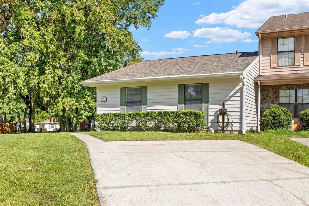 Photo of 828 Village Drive, Brooksville, FL 34601 (MLS # W7889764)