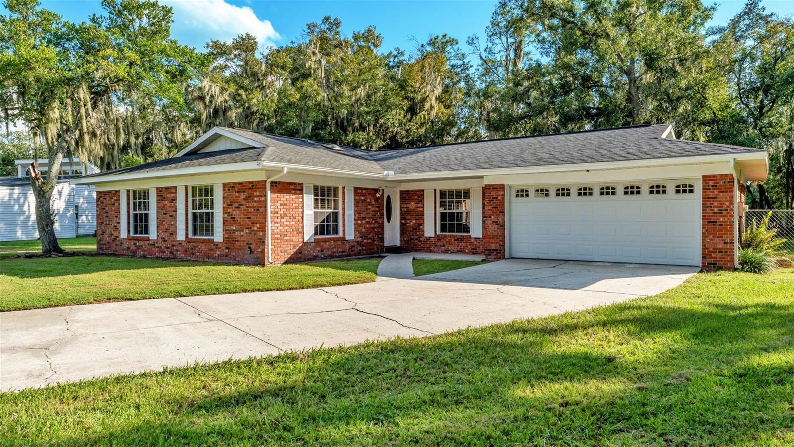 Welcome to 3050 Cross Fox Dr in beautiful Mulberry, FL! This 3-bedroom, 2-bathroom home offers 1,604 sq. ft. of comfortable living space on a spacious 0.29-acre lot with no rear neighbors! The well-appointed kitchen features ample cabinetry, generous counter space, and included appliances: refrigerator, range, microwave, and dishwasher. Ceiling fans throughout the home add to your year-round comfort. The primary suite includes an en suite bathroom with a walk-in shower for added privacy and convenience. Step outside to enjoy the back patio, perfect for relaxing or entertaining, along with an oversized, fully fenced backyard that includes a separate fenced area ideal for pets. The chain link fencing ensures security while preserving the open feel of the property. Take in the gorgeous pond view from your backyard and enjoy fishing from your private dock — all without the worry, as this home is not in a flood zone. Additional highlights include a 2-car garage plus an extended driveway for extra parking, making it ideal for guests or multiple vehicles. Located in a peaceful, country-style setting, yet just minutes from shopping, dining, and a short drive to South Lakeland — this home offers the best of both worlds: serenity and convenience. Don’t miss this opportunity to own a slice of Florida tranquility!