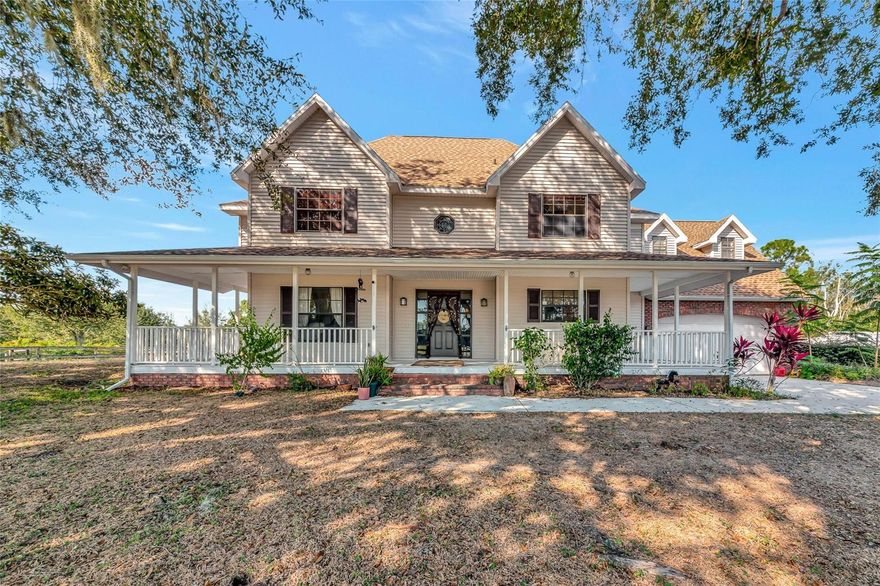 Welcome home to this breathtaking and spacious ranch-style residence nestled on 5 gorgeous acres in the highly sought-after Ranches at Bern Creek community. From the moment you arrive, you’ll feel the serenity of wide-open spaces, peaceful surroundings, and true country living, all just a short drive from modern conveniences. As you pull up the long dirt driveway, you’ll be greeted by a fenced barn area, perfect for getting your horses settled and enjoying the equestrian lifestyle this community is known for. The property also features a 2-car garage and abundant space for parking, trailers, and more. A charming wrap-around porch sets the tone for relaxing mornings with coffee or evenings spent sipping sweet tea while soaking in the tranquil views. Step inside and discover an oversized open floorplan filled with beautiful natural light, high ceilings, and tile flooring throughout the main level. The inviting living room boasts a cozy fireplace for gathering during the holidays or quiet nights in. Entertain in style in the formal dining room, perfect for hosting dinner parties and special celebrations. At the heart of the home sits the warm and welcoming kitchen, complete with wooden cabinetry, stainless steel appliances, and a built-in breakfast bar, a prime spot for casual brunches and morning chats. The main floor also includes a bonus office space, which could be used for remote work or creative projects, as well as a full-sized indoor laundry room for added convenience. Upstairs, an expansive loft area awaits, ideal as a second living room, game room, or a bright and airy office. Retreat to the luxurious primary suite, featuring wood flooring, custom built-ins, and an impressive en-suite bathroom with dual sinks, a garden-style soaking tub, and a spa-inspired walk-in shower. Two additional spacious bedrooms ensure plenty of room for family, guests, or flexible living. Off the back of the home, discover a fully enclosed porch perfect for indoor gardening, relaxation, or simply appreciating the serene views that stretch on for miles. Centrally located near top-rated schools, shopping, and dining, and less than 40 minutes from the world-famous sandy beaches of Siesta Key, this home delivers a blend of peaceful country living and easy access to coastal fun. Don’t miss your opportunity to experience the lifestyle you’ve been dreaming of, call today to schedule your private tour before this beauty is gone!