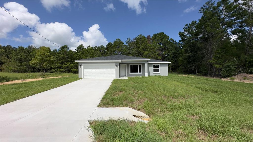 Photo of 122 Malauka Loop, Ocklawaha, FL 32179 (MLS # O6366237)