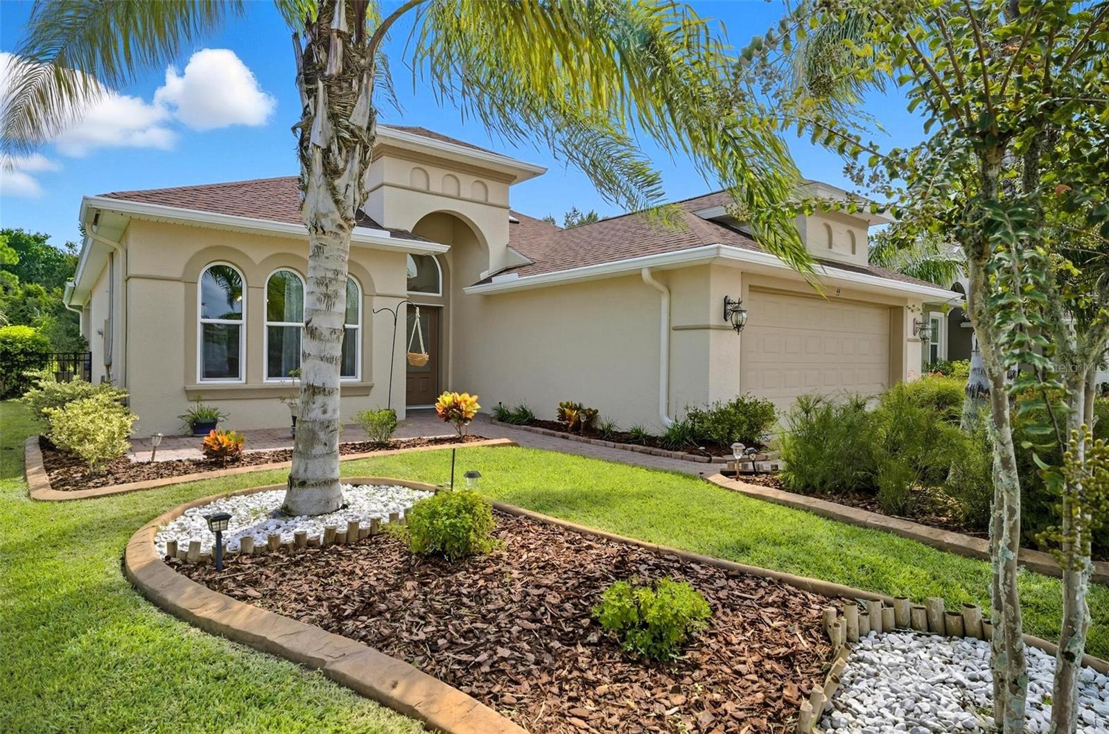 Welcome to this beautifully maintained home in the sought-after Hidden Lakes community! Built less than 5 years ago, this 3-bedroom, 2-bath residence blends modern design with timeless comfort. From the moment you walk through the front door, you’ll be greeted by an abundance of natural light, enhanced by multiple sets of sliders and sun tunnels that brighten every corner.
Inside, wood-grain tile flooring flows throughout the main living areas, while the open layout makes entertaining a breeze. The kitchen is a true centerpiece, featuring quartz countertops and plenty of space for both everyday meals and special gatherings. All bedrooms are generously sized and finished with easy-care vinyl flooring, giving this home a clean, modern feel.
Step outside to your private backyard retreat with peaceful lake views, framed by an aluminum fence for both style and function. A paver driveway, gutters, and thoughtful details throughout complete the picture.
Beyond the home, residents of Hidden Lakes enjoy wonderful amenities including a sparkling pool, sidewalks perfect for evening strolls, and a playground for family fun. With shopping, dining, and beaches just minutes away, this home is move-in ready and waiting for its next owner to enjoy the best of Palm Coast living!