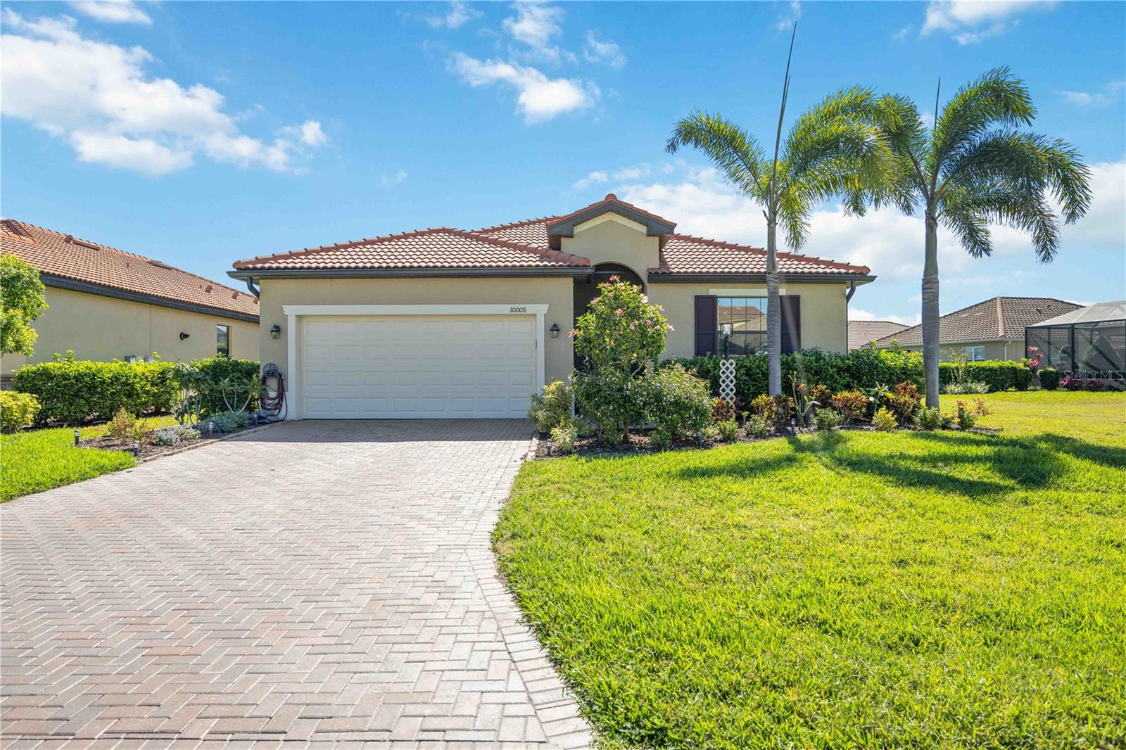 Your Dream Home Awaits!
**This home comes equipped with premium upgrades, including a WHOLE HOUSE GENERATOR & HURRICANE SHUTTERS—ensuring uninterrupted comfort and security during any storm, and offering true peace of mind year-round.**
This pristine corner lot home in The Links at Rosedale exudes charm and decorative style, offering a perfect blend of elegance and functionality. The standout kitchen features a beautiful backsplash, granite countertops, and ample space for culinary creativity. The third bedroom is ideal for a home office or guest room and can easily be converted back to a bedroom. The lovely primary suite is a true retreat, complete with a spa-like bathroom and a spacious walk-in closet. Beautiful tile floors flow through the main living areas and all the bedrooms.
Step outside to your private outdoor oasis, overlooking the lake, creating the perfect setting for relaxation and entertainment. The HVAC system includes an air purification system (HALO IAQ 2025). Additional upgrades include a whole-house generator, hurricane shutters, sun control film on windows (tinted), sun shade on the lanai, outdoor lighting, wireless motion sensors under the kitchen cabinets, and an insulated garage door. Gorgeous landscaping adds to the serene and secluded atmosphere, making this home a true sanctuary.
Don’t miss the opportunity to experience this incredible home. Schedule your private showing today!
As a resident of The Links at Rosedale, you’ll enjoy an active country club lifestyle with a social membership that includes access to five Har-Tru tennis courts, a Junior-size Olympic swimming pool, a state-of-the-art wellness center, and a modern clubhouse offering a dining room, lounge, and bistro patio. Optional tennis and golf memberships are available. With community fees covering two manned gates, dog parks, internet, cable, and landscaping, plus no CDD fees, you’ll relish low-maintenance living. Centrally located in Bradenton/Lakewood Ranch, you are just minutes from I-75, Lakewood Ranch, the UTC Mall, Gulf-coast beaches, and the Sarasota/Bradenton International Airport.