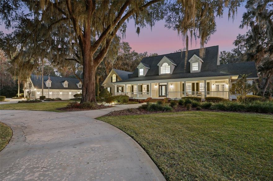 $340,000 PRICE IMPROVEMENT, SELLER MOTIVATED! Welcome home to “Enchanted Oaks” a truly rare, must-see, newly renovated estate in Alachua Highlands, nestled on 5+ AC amongst a canopy of remarkable Grand Daddy Oaks that are nearly impossible to replicate. This exceptional luxury residence spans nearly 5900 SQ of refined multi-generational living space, offering privacy, character & tranquility seldom found in Alachua County. The main home consists of +4300 SQ w/4 beds/4.5 baths, entering the home you're greeted to an open-airy foyer that draws you into the open floorplan gushing w/natural light, showcasing the large 2-story family room w/a wall of windows overlooking the pool & yard. The double-sided brick fireplace makes for a perfect blend between the family room & kitchen which features quartz countertops, tile backsplash, stainless steel appliances, an abundance of cabinetry including pull-out shelving & spice rack, sink w/pass-thru window, functional island w/storage & breakfast bar. Butler’s pantry w/wine rack, cabinets w/glass front doors & large walk-in pantry. Enjoy in-kitchen dining area & bring the outside-in when opening the French door leading to the screened rear porch. Separate dining room flows seamlessly to the kitchen for ease of entertaining & flanking the other side of the foyer is a cozy & welcoming Den/Flex area w/French doors opening to the covered front porch. 1st floor has full bath w/tub/shower combo. Stepping through the private double door entry to the oversized Primary Suite showcasing an inset fireplace, sitting area w/views of the yard, walk-in closet w/built-in custom drawers & shelving. The ensuite bath features separate large double vanities, jetted tub, glass enclosed shower, water closet & outlined w/windows. As you make your way upstairs all the secondary BDRS are oversized, BDR 1 has dormer window seats, separate office area & multiple closets. BDR 2, has dormer window seats, multiple closets & ensuite bathroom. 2nd full bath set-up Jack-n-Jill style w/single vanity, water closet & tub/shower combo. BDR 3 has dormer window seats, multiple closets & private access w/staircase to garage. BDR 3 also has separate hobby/craft room w/half bath. 4th full bath used for pool &/or BDR 3 is located inside the 3 car garage. The screened rear porch makes for a sitting retreat w/expansive view of yard. The paver lined walkway/patio provides usable space for outside dining area & leads to saltwater sports pool featuring lap lane, bubbler w/sun deck & in-pool v-ball & b-ball set-up. Firepit area & picnic/dining are under the covered gazebo. Exterior landscape lighting, electricity & water sources. Large barn great for storage/equipment w/side windows that open out, can convert to stalls & open covered area. The 2nd building on the property boasts a heated/cooled 4 Car Garage, for car enthusiasts, outdoor toys, gaming, etc. w/5 overhead doors, electricity in ceiling & wash sink w/cabinets. Inside the garage is full kitchen, (5th) full bath w/shower & office. Upstairs is the furnished apartment +1100 SQ including full kitchen w/granite countertops (new fridge), (6th) full bath w/shower, washer/dryer & large walk-in closet. Located behind detached bldg is the covered RV port (approx. 42 feet) w/ concrete drive, full-hook (50 amp, sewer & water) & separate extra wide gate for easy pull-in. Property is gated & fully board fenced w/additional wire fencing into ground, gutters & irrigation. BACKS to San Felasco Park!