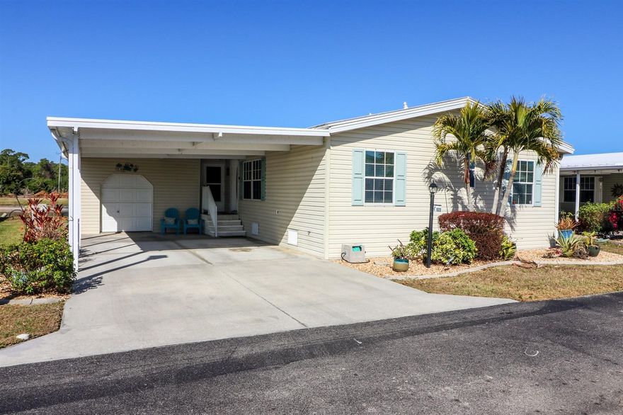 Water & Golf View cant get any better than this HOME located: 29200 Jones Loop Rd #522, Punta Gorda, Fl. 33950 in Blue Heron Pines a Large Pet Friendly Active 55+ Community! 4 Car Carport w/Golf Cart Garage. Updates: New Roof  2023. Enter Bevelled Glass Door into Home. Open Floor Plan with Dining Area offset w/upgraded Lighting. Stone Window Sills. Neutral Paint Thru Home. Bonus Room currently a Den/Office,But! will accommodate a Queen Size Grouping! Hall with additional Linen Closet. Guest Bath Tile Flooring with Shower & Seat. Guest BedRoom Queen Size Grouping. Luxury Vinyl Planking Thru Home. Vaulted Ceilings. New Ceiling Fans. Primary BedRoom accommodates King Size Grouping. Walk-In Closet. Primary Bath 8' Tile Flooring. Dual Vanity. Shower has Handi-rails. Additional Linen Storage. Jacobsen Curio Kitchen Cabinets. 8' Tile Deep Dual Sink w/ Disposal & Pass Thru Window to Lanai. Hood Microwave over Flat Top Range. Dishwasher. French Door Bottom Freezer Refrigerator. Pantry. Upper & Lower Cabinets with Knic/Knac Above Cabinet for your Plants or Antique Plates,Etc. Laundry Alcove with Waher & Dryer included in the Sale. Breakfast Nook with Water & Golf Views of Florida's Best SunRise or Sunsets! Lanai with 8' tile Enclosed with Tinted Acryllic Windows. Outside Patio w/rails. No Golf Ball Zone. Call TODAY for Your Tour of this Wonderful Community!