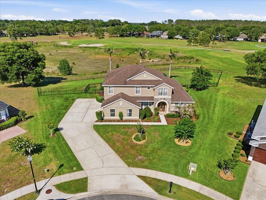Welcome to the prestigious, man-guarded community of Sorrento Hills, where luxury living meets everyday comfort! This stunning 3,645 sq ft home sits on over .64 of an acre in a sought-after cul-de-sac location, offering exceptional privacy and breathtaking views of the 8th hole of the golf course. The primary suite is conveniently located on the first floor and is one of five spacious bedrooms this home has to offer. Brand new luxury vinyl flooring flows through the office/5th bedroom, dining room, primary suite, and family room, while beautiful plantation shutters add timeless elegance and effortless style throughout. The chef-inspired kitchen features 42" cabinets with crown moulding, granite countertops, and a brand new refrigerator. Granite continues into every bathroom for a cohesive, upscale feel. Step outside to your private oasis — a gorgeous PebbleTech pool with a newer heater, perfectly framed by the lush fairway beyond. The fully fenced, expansive yard is serviced by a sprinkler well, keeping your water bills impressively low while maintaining a beautiful lawn year-round. Major updates include a new roof (2021) and new hot water heater (2021), plus newly installed garage door openers. Washer and dryer convey, with an additional hookup in the garage. Sorrento Hills amenities include golf, clubhouse, fitness center, pool, tennis courts, and a playground — truly a community that has it all. This is the one you've been waiting for!