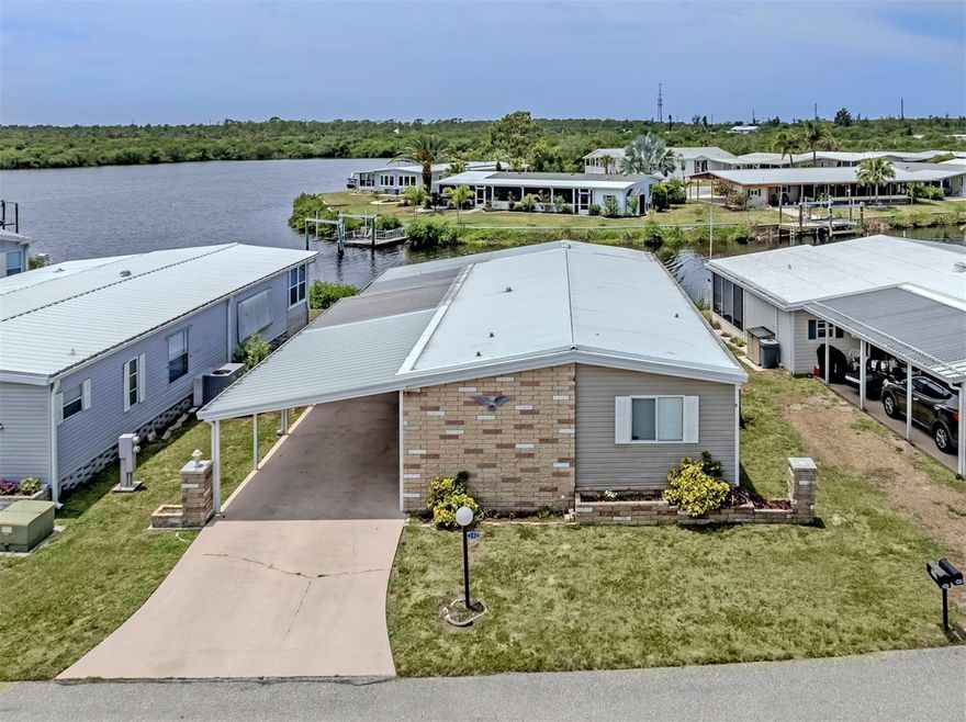 Wake up to breathtaking, ever-changing views of the Myakka River in this beautifully maintained 2 bedroom, 2 bath home located in the highly sought-after boating community of Lazy River Village. Perfectly positioned to capture spectacular 180-degree water views, this home offers a front-row seat to Florida’s natural beauty right from your own backyard.
Step inside to find a spacious, light-filled living area where large windows frame the river, creating a peaceful and inviting atmosphere. The kitchen is generously sized with updated cabinet doors and ample storage, making it both functional and stylish. Just beyond, a versatile bonus room provides the perfect space for a home office, den, or hobby area.
One of the true highlights of this home is the incredible Florida room, featuring acrylic windows and quality blinds, where you can relax year-round while taking in sweeping panoramic views of the water. Outside, a covered patio offers another tranquil space to unwind, entertain, or simply enjoy the river breeze.
Boating enthusiasts will appreciate the private dock just steps behind the home, offering easy access to the Myakka River and beyond. Inside, both bedrooms are generously sized with large closets, while the guest bath features a beautifully tiled shower and the primary bath offers double sinks and abundant storage.
Additional updates provide peace of mind, including plywood subfloors throughout, a carport built to code just two years ago, a four-year-old A/C system, and new soffits around the entire home. Vinyl tile flooring throughout adds durability and a clean, cohesive look.
Lazy River Village is a vibrant, resident-owned, 55+ waterfront community known for its active lifestyle and exceptional amenities. Residents enjoy a marina, boat slips, kayak launch, and direct access to the Myakka River. The community also offers a clubhouse, pool, fitness center, tennis courts, and a full calendar of social activities, creating the perfect blend of relaxation and connection.
This is more than just a home—it’s a waterfront lifestyle with unmatched views and endless opportunities to enjoy the best of Florida living.