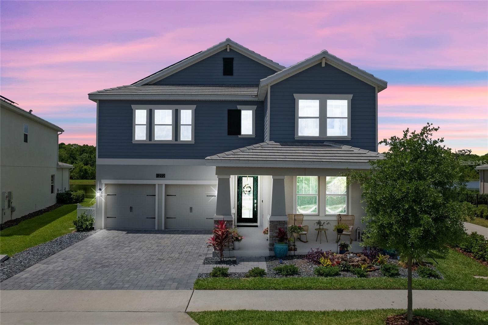 This Solar Powered home built in 2020 - has everything you’re looking for! Slate Tile Roof facing East-West with no neighbor in front or behind. Enjoy lovely sunrises from your front porch overlooking a community park; and relax with colorful sunsets over the ponds from your back porch. Located right off the community trail head, peaceful nature walks and bike rides are available anytime right from your backyard. Inside, Water and Conservation views can be seen from almost every room! Wood look Ceramic Tile covers the entire downstairs living areas, and in the Kitchen you’ll find gorgeous 42” Grey Cabinetry, Quartz Countertops with a huge Island, GE Slate Appliances, and a Butler’s Pantry with large Walk-In Pantry. In the Living Room, sitting in front of the Custom Brick Surround Electric Fireplace surrounded by nature views will give you the feeling you’re on vacation its so relaxing! Downstairs you’ll also find the Master Bedroom with Tray Ceiling and a Dining Room which can be used as an Office or Family Room. There’s also a Laundry Room on the 1st Floor with stackable Washer and Dryer. Upstairs in the Loft is your movie room, game room or whatever you want it to be - the space is over 500 square feet! In the 4 secondary bedrooms, each measures at least 13x14 feet and offers either a Walk-In Closet or a Double Closet. Two Full Bathrooms upstairs include Double Sinks in each with a door that separates the Shower area. The 2nd Laundry Room is spacious and also includes a washer and dryer. In the 3 Car Tandem Garage, you’ll not only find plenty of more space, the area is also air conditioned with a mini-split system. Average power bills are under $100 a month! Storey Park amenities include a Resort Style Pool, Tennis Courts, 24 Hour Fitness Center, Clubhouse, On Site HOA management, 24 Hour Roaming Security, Dog Park, Playgrounds and miles of Natural Trails. Conveniently located right off the 417 with easy connectivity to 528, I4 - and just minutes away from all Lake Nona has to offer! Zoned for SunBlaze Elementary, Innovation Middle School and Lake Nona High School. APPLY TODAY