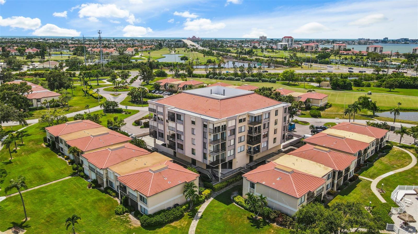 This charming 2-bedroom, 2-bathroom condo offers a light and bright living space with scenic water views of Boca Ciega Bay and the championship Isla Del Sol Golf Course. Boasting 1,050 square feet of comfortable living, this home features newer carpet flooring and a split floor plan for added privacy. The kitchen and second bedroom both offer partial water views, while the spacious living room and dining room combination create an inviting atmosphere. Relax in the enclosed balcony with hurricane shutters, perfect for enjoying the views year-round. The condo is partially furnished and includes a washer and dryer for your convenience.
Palma Del Mar residents enjoy resort-style amenities, including a heated pool, Jacuzzi, fishing pier, and a game/bonus room. The condo offers 2nd-floor parking, key entry for added security, and a yearly lease option. Water, sewer, cable, internet, and trash services are included in the rent. Ideally located on Isla Del Sol, this condo is just minutes from the world-renowned Gulf Beaches, Pinellas Bike Trail, Ft. DeSoto Park, and downtown St. Petersburg. With easy access to I-275, Eckerd College, and only 25 minutes to both Tampa International and St. Pete/Clearwater airports, this home offers the ultimate in convenience and lifestyle.