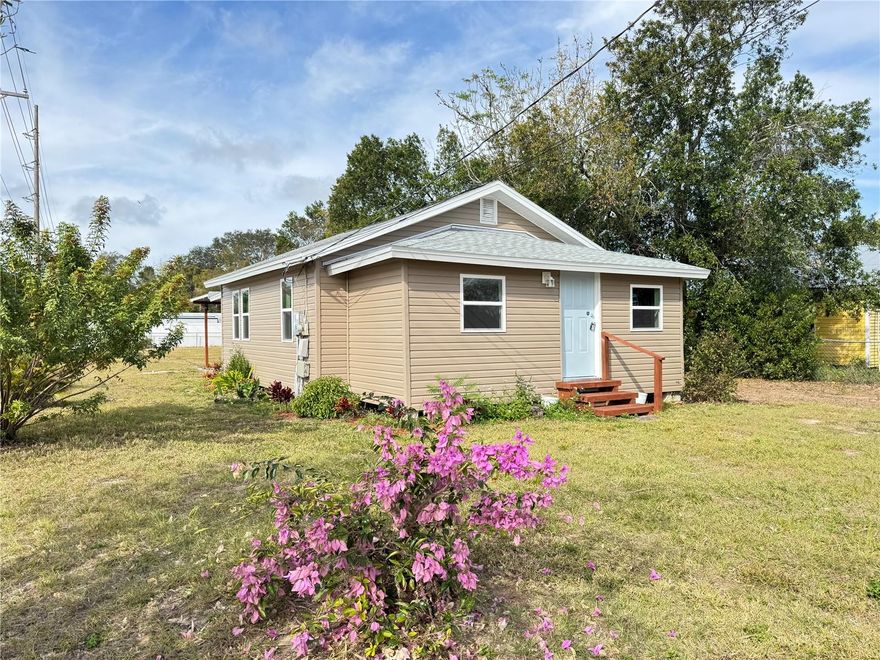 OVERSIZED CORNER LOT! This charming single-family home in the desirable Auburndale Heights neighborhood offers a perfect blend of modern upgrades and cozy living. Featuring 2 bedrooms and 1 bathroom, the home has been completely updated with contemporary finishes throughout, a new roof and new energy efficient windows. Situated on an oversized corner lot, the property boasts ample outdoor space for gardening, entertaining, or expansion. Inside, you'll find an open concept living area with lots of natural light, a stylish kitchen with new stainless-steel appliances, and updated vinyl flooring. Ideal for first-time buyers, investors, or those looking to downsize in a quiet, family-friendly area with no HOA. Tenant in place, please do not disturb.