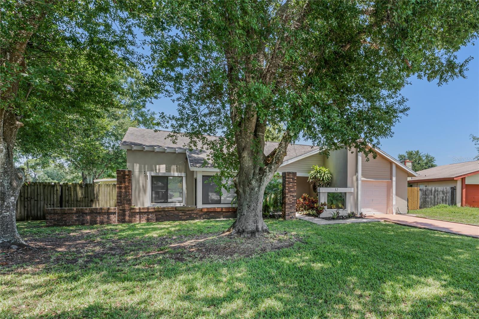 You’ve got to see this! Exceptional larger home in this lovely Poinciana neighborhood. Home sits on a cul-de-sac with a nature preserve immediately behind the property. This 3br/2ba home features an office, large living/dining room area, granite kitchen counter tops and awesome hood fan, super cozy family room with fireplace, huge Florida room, all tile floors. All this on a huge lot, over 1/4 acre! The roof was replaced in 2016, the flooring replaced in 2014, hot hybrid water heater replaced in December 2018, garbage disposal in 2022. The solar panels were installed in December 2018. A lovely home with lots of unique extras. Super clean and move-in ready! Schedule your showing today!