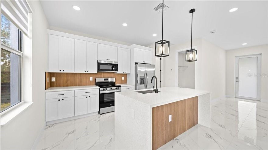 One or more photo(s) has been virtually staged. Beautiful new construction home in Port Charlotte featuring 3 bedrooms and 2 bathrooms with a modern open floor plan and quality finishes throughout. This home offers a bright and spacious living area, comfortable bedrooms, and a contemporary kitchen perfect for everyday living and entertaining. Conveniently located near shopping, dining, schools, and main roads. No HOA. Great opportunity for homeowners or investors looking for a move-in ready property.  Don’t miss this opportunity.Photos are of a similar property and are for illustrative purposes only.