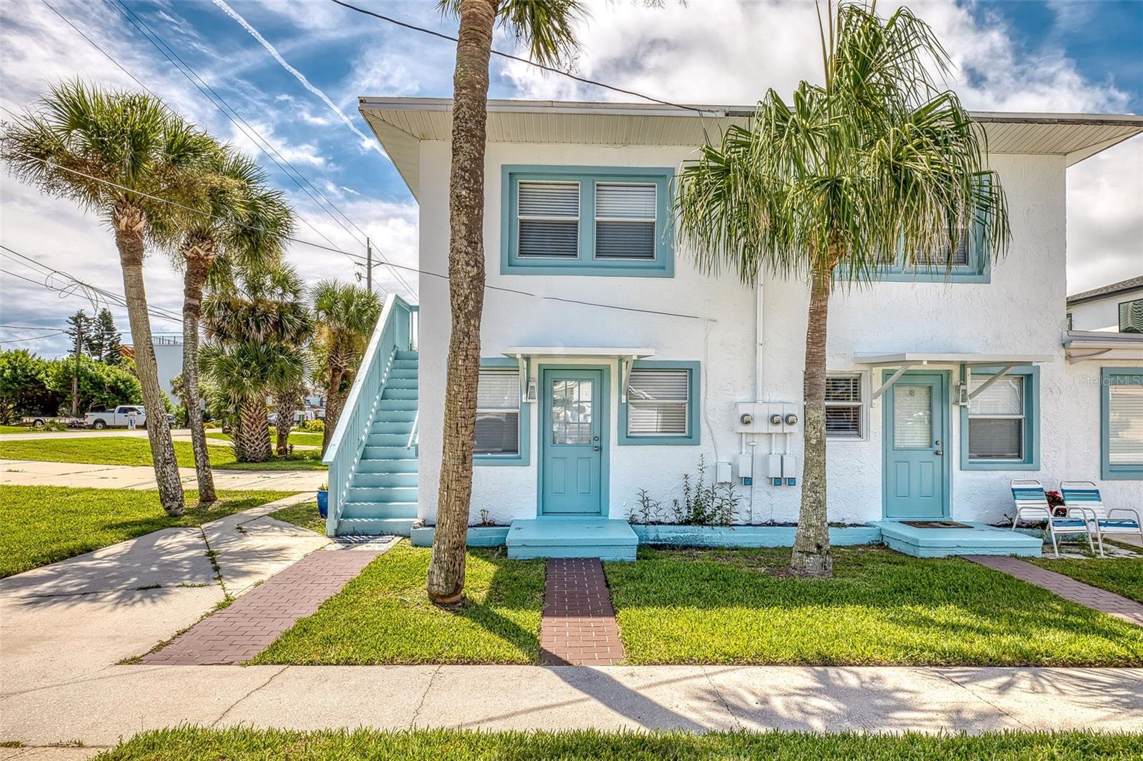 Beachy Triplex – Steps from the Ocean in Bethune Beach. Exceptional opportunity to own a fully furnished triplex / family compound, ideally located less than 700 feet from the pristine no-drive beach. Constructed of durable concrete block and situated on a prominent corner lot, this well-maintained property offers a rare blend of versatility, location, and income potential. Zoned multi-family, up to 5 units. Currently configured as a family compound, the property is being offered fully furnished (excluding personal items) and includes three individual units: two 1-bedroom, 1-bath units on the ground level, and a spacious 2-bedroom, 1-bath unit occupying the second floor. Each unit is separately metered for utilities, providing added flexibility for rental or personal use. Additional features include a shared community laundry room and close proximity to the beach, river and JB’s Fish Camp Restaurant. Whether you're seeking a strong investment opportunity, vacation rental potential (30 day minimum), or a multigenerational retreat, this property must be seen to fully appreciate all its potential. A short 5 minute drive to the National Canaveral Seashore Park, which boats a boat and kayak launch or access to undeveloped and pristine beachfront.