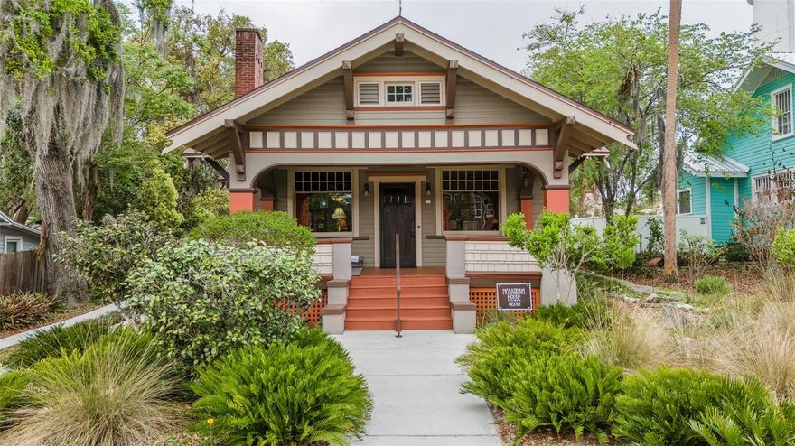 Just now available this Downtown DeLand “One of a kind” Circa 1921 restored Bungalow… 
This home was featured in American Bungalow magazine that showcased this piece of art.
Offering 3 bedrooms and  2 baths… with two of the bedrooms conveniently located downstairs. Incredible original heart pine floors are in most areas. As well as the stained original baseboards, doors and millwork to match the floors!  Exposed beams on the high ceilings adds to this homes stately charm.  Meticulously maintained with updates throughout that include a brand new roof!   Whether relaxing on the front porch or dining outside on the extended patio with beautiful pavers, you can soak in this picturesque setting.
Literally steps from the heart of Downtown.  This charmer is right across the street from Northwest Square where you can enjoy their gourmet coffee, market and pub.
A storybook lifestyle that many could only dream of and now could be yours!