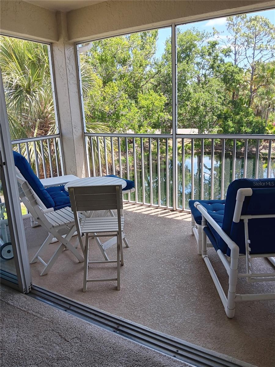 Auburn Lakes is a small 80 unit complex with a heated pool and clubhouse, the perfect blend of coastal living and urban convenience. This 3-bedr, 2-bath condo is located close to all that Venice offers. The kitchen features silestone countertops which are not only beautiful but durable, non porous and stain resistant. Additional Updates to the kitchen include Diswasher & Refrig in 2022, Garbage disposal in 2024, Stove 2023. You have ceramic floors at the entry, kitchen, dining and Bathrooms, but carpet in bedrooms and LR for comfort and quiet. Enjoy your morning coffee and contemplate your day while watching the sun come up (Lanai faces east ) which has a new cage and has been recently rescreened. The master bedr overlooks the water, has a large walk in closet and an ensuite with shower, double sinks and a separate water closet. The guest bedroom is positioned for priivacy on the other side of the unit. Some other updates include some big ticket items such as a new A/C in 2024! New HWHeater 2020 and a new Washer & Dryer in 2018. This condo includes the furniture with the exception of the chest in the entryway. Practical amenities include additional storage space for bikes and paddle boards, beach equipment and more in the downstairs storage unit under the carport. Conveniently across the stteet is the pool. This complex has had all new roofs put on a few years ago with "no special assessment" to the owners. A solidly run Home Owners Association with reasonable fees. 15 min to the Beaches and the historic Downtown.