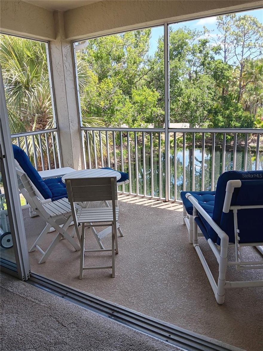 PRICED RDUCED!  Discover  the charm of this small,  80 unit Pet Friendly complex that features a heated pool, clubhouse, and serene water views!  This 3 bedr- 2 bath condo is move in ready, being sold furnished.  It makes great winter get away or/ the perfect rental property with upgrades that include in the kitchen silestone countertops that are beautiful, durable, and stain resistant,  newer Diswasher, Refrig, Garbage disposal, and stove. Granite Counter tops in both baths.   Easy to clean neutral Ceramic plank flooring highlights the entryway, kitchen and dining room area while carpet in bedrooms and LR add that warm, cosy feeling.  Enjoy morning coffee and contemplate your day while watching the sun come up over the lake on the lanai.  The lania has a new cage and has been recently rescreened.  The Living room, Master bedr and Eating area all look out over the water creating a peaceful setting throughout.  The master suite has a large walk in closet and an ensuite bath with shower, double sinks and a separate water closet.  The guest bedroom is positioned on the other side of the unit for privacy.  Other updates include  "big ticket"  items like  a *A/C in 2024 *HWHeater 2020, *Washer & Dryer in 2018.  Practical amenities include a large storage space for bikes, beach equipment in the downstairs storage unit under the carport.  A few steps away across the street is the pool, clubhouse, mailbox, & trash recepticle.  All the roofs were replaced a few years ago with "no special assessment" to the owners!   Enjoy all the benefits of a 2nd floor unit like "vaulted ceilings, expanded views of the lake, and no noise from above".  The best part is that you can leave those sliders, windows open all nite and capture all those cool evening breezes.  This Complex has one of the most reasonable HOA fees in it's price range.  The big bonus is that it is only 15 min to the beautiful Gulf Beaches and Venice's Historic Downtown District.