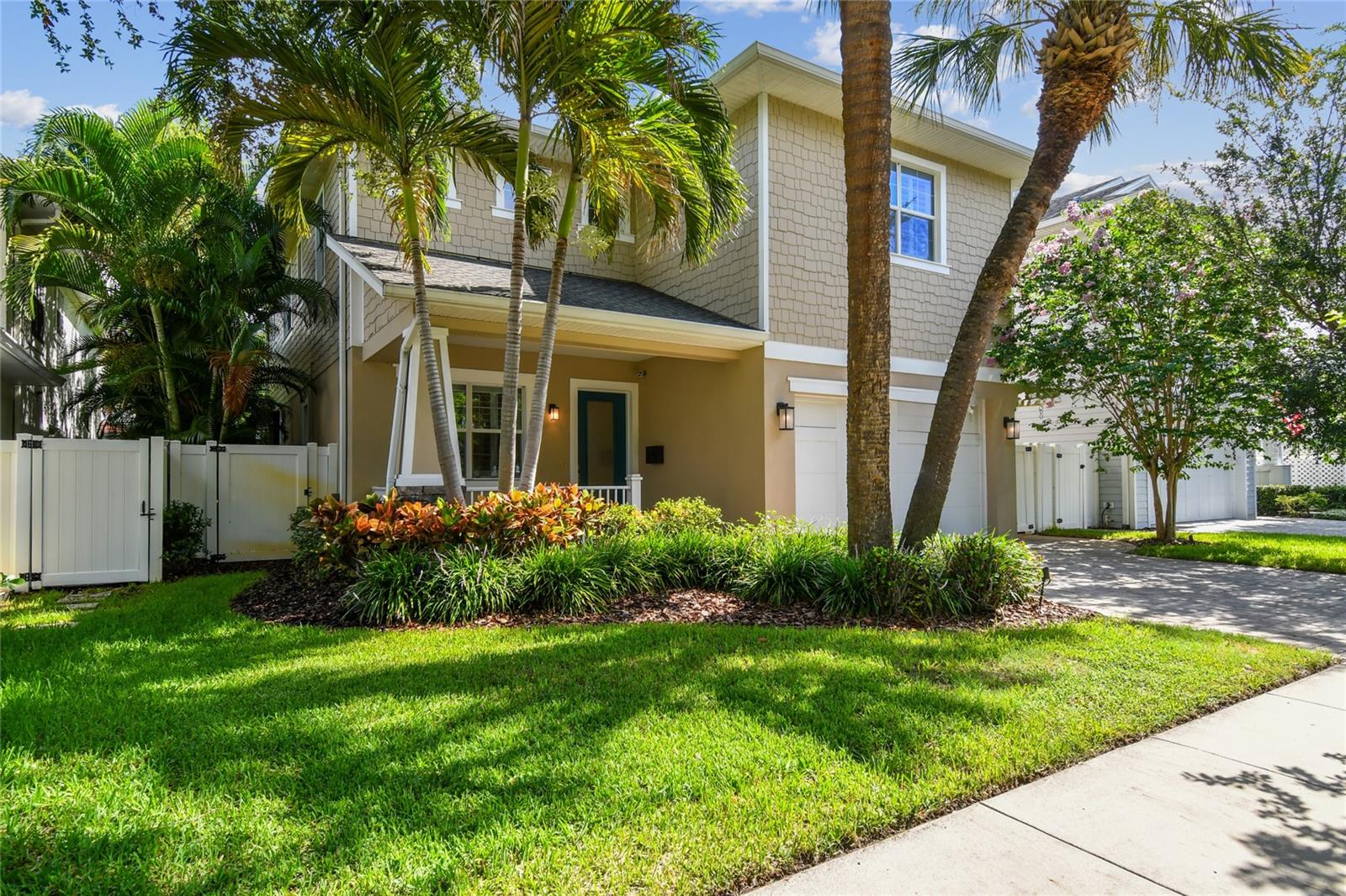 Situated just three blocks from iconic Bayshore Boulevard and steps from the lively shops and restaurants along MacDill and Bay to Bay, this beautifully-crafted 5-bedroom, 4-bathroom, 2-car garage home offers timeless style and exceptional comfort in South Tampa’s coveted Palma Ceia neighborhood. Built in 2015 by Barritz Builders, the home welcomes you with a covered front porch and an expansive open floor plan featuring 10-foot ceilings, a formal dining room, and a custom built-in entertainment center. The gourmet kitchen is designed for both entertaining and everyday living, complete with a large quartz island, stainless steel appliances, gas cooktop and oven, auto-close cabinetry, and an oversized walk-in pantry with custom shelving. Glass sliders open to the screened lanai and pool area, where a heated spa, waterfall feature, LED lighting, and lush landscaping create a year-round outdoor oasis. A surround sound system throughout the main floor living areas and lanai enhances the luxurious setting whether entertaining or unwinding. A first-floor guest suite or office offers private access to the pool through French doors and is conveniently located next to a full bath with high-end porcelain tile and generous glass-enclosed walk-in shower. The wet bar/coffee station with beverage fridge and cabinet storage offers additional high-end refinements and functionality. The second floor includes four spacious bedrooms with custom closets, three full baths, and a large laundry room with built-in cabinetry and utility sink. The primary suite boasts a spa-like 5 piece bath with a soaking tub for relaxing, a glass-enclosed shower, split vanities, and a expansive custom walk-in closet and dressing area with a built-in shelving system. Built with quality and durability for peace of mind, the home features block construction, a hurricane-rated garage door, Hardie shake cement fiber siding, brick paver driveway and porches, and a full security system with cameras at both the front and rear of the home. Interior finishes include hand-scraped hardwood floors, 8-foot solid wood doors, maple stairs, and elegant crown molding throughout. Additional amenities include two tankless gas water heaters, a dedicated electronics closet, and a whole-home water softener system. Located in a non-flood zone and zoned for Plant High, Coleman Middle, and Roosevelt Elementary, this move-in ready residence offers both elegance and practicality. Enjoy the best of the Tampa Bay lifestyle—just a 15-minute drive to Tampa International Airport, with easy access to professional sports venues, Palma Ceia Country Club, Hyde Park Village, award-winning restaurants, and year-round waterfront recreation including boating, fishing, and beach-going.