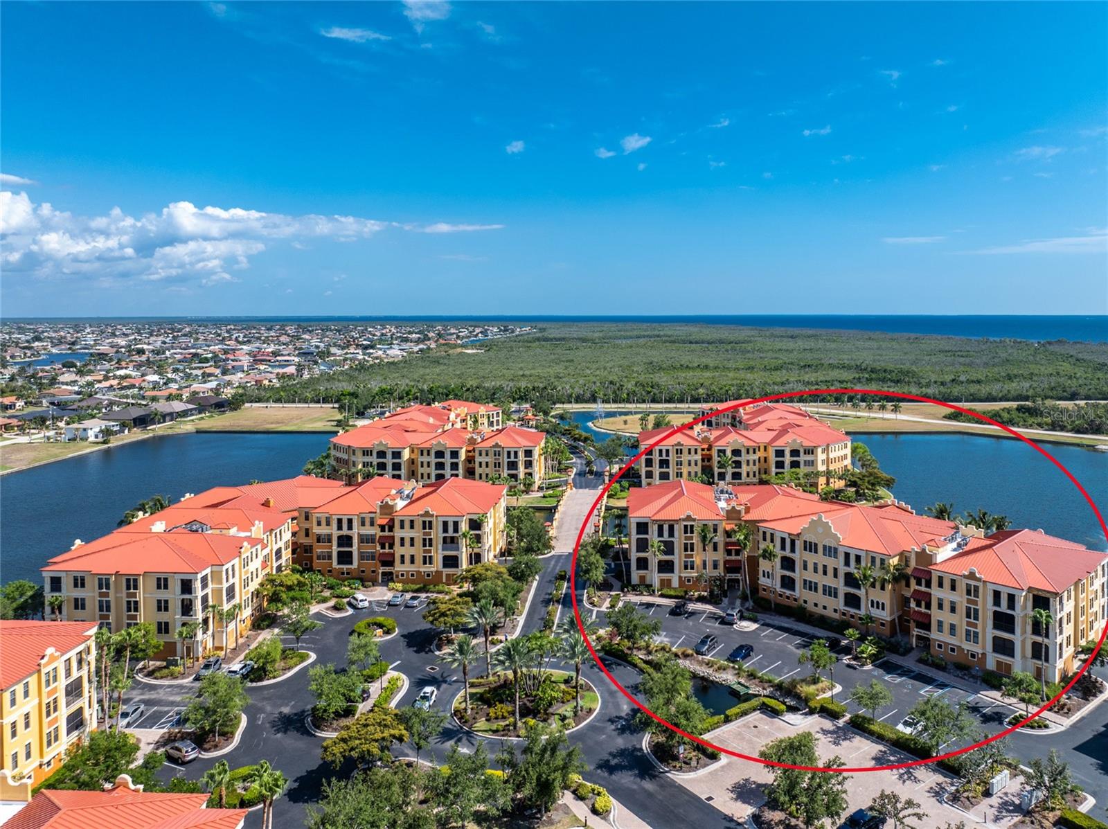 One or more photo(s) has been virtually staged. Welcome to Vivante, Punta Gorda's premier address for Resort Style living. Residents enjoy top-notch amenities and lushly landscaped grounds in this Mediterranean style complex featuring a gorgeous Resort Style Pool and Spa, Lap Pool, Tennis Courts, Club Room, Billiard Room, state of the art Fitness Center with aerobics room, Men's and Women's Locker Rooms with Steam and Sauna and even onsite spa services! This 4th Floor 2 Bedroom, 2 Bathroom, split floor plan unit is just what you're looking for. High 10- foot ceilings, 8- foot doors, 6- inch baseboards and 3 ½ inch casings provide an open and airy living space. Glass doors in the Living Room and Dining area both open to a lovely tiled and screened lanai? what a great place to end your day. The bright Kitchen features 42? cabinets, solid surface counter tops with breakfast bar, GE appliances, a deep stainless- steel double bowl sink and built in desk. The dinette area is located off the kitchen and features high windows and a door to the lanai. The roomy Primary Bedroom features an En-Suite bathroom, 3 windows, glass door to the lanai and 2 ample closets. The Primary bathroom features a glass enclosed walk-in shower, a luxurious soaking tub, dual vanities and private water closet. The guest Bedroom features a walk-in closet and separate door to the guest bathroom for your guest's privacy. The Guest Bathroom pocketing has entrance doors from both the Main living area and the Guest Bedroom and features a glass enclosed walk-in shower. The Laundry Room is located just off the kitchen. For peace of mind, you'll find complete hurricane protection that includes impact glass windows. The unit's spacious 12x24 garage is located under the building. Located at the mouth of the Peace River, it's just a short drive to Downtown Punta Gorda, one of Florida's best small towns, with plenty of restaurants and town activities to enjoy. Just a short drive to the new Sunseeker Resort, it doesn't get any better than this to live your dream Florida Lifestyle.