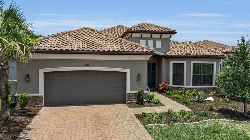 Welcome to luxury resort-style living in the highly sought-after community of Esplanade at Artisan Lakes. Perfectly positioned at the end of a quiet cul-de-sac street, this beautifully upgraded Taylor Morrison Palazzio floorplan blends elegance, comfort, and functionality while offering exceptional indoor-outdoor living on a premium oversized preserve-view homesite.
From the moment you enter, you’ll appreciate the upscale finishes and thoughtful design throughout, including soaring 8-foot interior doors, expansive open-concept living spaces, and designer touches that create a warm yet sophisticated atmosphere.
At the heart of the home is a chef-inspired gourmet kitchen featuring high-end Monogram professional-grade appliances, premium cabinetry, and an oversized island ideal for entertaining family and friends. Adjacent to the main living area, the stylish custom bar is a true showpiece featuring a 100-bottle dual-temperature wine refrigerator designed for effortless entertaining.
The spacious primary suite offers a luxurious private retreat complete with a spa-like ensuite bath and a custom-designed walk-in closet system that can easily be reconfigured to suit the next owner’s personal needs and style.
Step outside to your expansive oversized lanai and patio overlooking peaceful preserve views, the perfect setting for morning coffee, outdoor dining, or relaxing Florida evenings year-round.
The oversized garage has been extended an additional 4 feet, offering enhanced functionality for larger vehicles, storage, hobbies, or a golf cart. Additional garage upgrades include professional-grade polyaspartic flooring, overhead storage, and electric vehicle charging capability.
Additional upgrades include a whole-house water softener system and numerous high-end enhancements throughout the home.
Living in Esplanade at Artisan Lakes means enjoying a true maintenance-free resort lifestyle with HOA services that include lawn care, landscaping maintenance, internet, and cable. Residents also enjoy world-class amenities including:
Resort-style clubhouse
* Heated lagoon-style pool and spa
* Fitness and wellness center
* Resistance pool
* Har-Tru tennis courts
* Pickleball courts
* Scenic walking trails, lakes, and preserves
* Gated entrance with enhanced security
* Full-time Lifestyle Director coordinating social clubs, events, and activities
Perfectly located in Palmetto near everyday conveniences including the future BayCare Hospital, Publix, shopping, dining, and popular sports bars, this home also offers easy commuter access to Tampa, St. Petersburg, and Sarasota.
This is more than just a home, it’s a lifestyle.