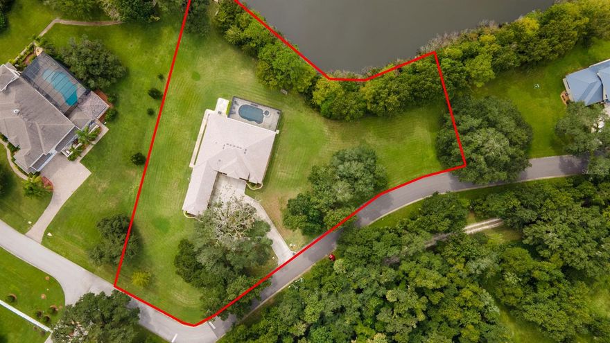 With 290 feet of pristine lake frontage on 2 acres, this 2017-built, 4 bdrm 3.5 bath pool home with 4 car garage in gated Lake Waterford Estates offers amazing privacy & space & is just minutes to town & the beach.  Granite & stainless kitchen with walk-in pantry, soft-touch drawers, bar seating & breakfast nook.  Family room with gas fireplace, custom stone, automatic blinds & beautiful views from large windows.  Separate living & dining rooms.  Office with glass French doors .  The spacious master suite has double walk in closets, rain head shower & garden tub.  Junior suite with private bath is on opposite side of house.   Salt-water pool with electric-heated spa spillover in screened lanai with substantial under roof area to enjoy the summer kitchen & outdoor living rain or shine.  Access the lanai & pool from triple sliders in livingroom, sliders in family room & atrium door in master suite.  Dock with lift & ledge for easy on/off for SUP & kayaks.   Separate laundry & mud rooms.   The 4 car garage measures 50x23 so you can bring all your toys!   Propane fuels the fireplace & whole-house generator.   Peaceful setting on 75 acre freshwater lake.  Circular driveway with majestic Oaks.  There is also a community club house, with boat launch, dock, basketball & tennis/pickle ball court.  Exclude master bath chandelier. ;Water: City