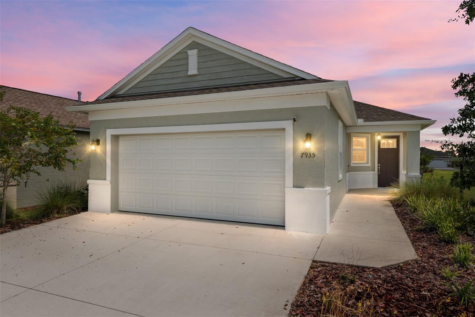 Welcome to this beautifully upgraded home in Weybourne Landing at On Top of the World! The great room with crown molding flows seamlessly into the dining area and open kitchen, leading out to a screened lanai with fan, TV mount and knee wall designed for future Florida room conversion. Gas line on outdoor patio for grilling/summer kitchen if desired. The kitchen features upgraded countertops, backsplash, cabinetry with lazy Susan, disposal button, pantry, breakfast bar, stainless refrigerator, and gas range. Split plan bedrooms include a spacious master suite with large walk-in closet, frameless glass shower with bench and grab bar, dual sinks, and private toilet room with solar light. The guest suite is tucked into its own alcove with nearby full bath and laundry room (washer, gas dryer, and storage included).
Enjoy outdoor living with an extended paver patio and fully vinyl-fenced backyard. The smart-home package includes Ring doorbell and wireless thermostat. Oversized garage (extra 4 feet) offers expanded driveway, hanging storage, shelving, and fold-down work tables. Additional highlights: mature landscaping, gutters front and back, Genesis water softener, and no CDD or land lease.
Weybourne Landing residents enjoy a private clubhouse and pool, plus pickleball, mini-golf, dog park, and more. Optional pass to the main OTOW amenities is available. Walking or biking to Sholom Park or Circle Square Commons is easy from this location. A truly special home with upgrades and community features that make it stand out—come see all it has to offer!