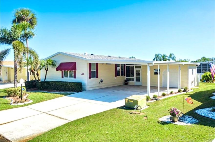Well-Maintained 3BR Palm Harbor Home with New Roof & A/C! Welcome to this beautifully maintained 2002 Palm Harbor home located in the desirable 55+ land owned community of Imperial Lakes Estates. This 3-bedroom, 2-bathroom home offers 1,566 sq. ft. of living space and nearly 2,900 sq. ft. under roof, providing plenty of room to relax and entertain. Step inside to find high ceilings and plenty of natural light throughout. The galley-style kitchen features abundant cabinet space, a pantry, and an inviting breakfast area, ideal for casual meals or morning coffee. The formal dining area greets you as you enter the home and flows into a spacious living room, which makes it perfect for entertaining. The primary suite includes a large closet plus an ensuite bath featuring dual sinks, a walk-in shower, and an additional walk-in closet. Both guest bedrooms are generously sized, and the guest bath offers a tub/shower combination. Additional highlights include an indoor laundry room and abundant storage throughout the house. Imagine being able to enjoy Florida living year-round in the large enclosed lanai. The workshop/garage provides ample space for storage and a remote control door for easy golf cart parking. A two-car covered carport and large driveway offer plenty of parking. Recent updates include a new roof and new A/C. The Imperial Lakes Estates community is truly a wonderful place to reside, offering an abundance of activities and amenities such as two heated pools and a spa, tennis and pickleball courts, shuffleboard, a billiard room, library, and picnic area. Throughout the year, residents can enjoy numerous social events that make it easy to connect with neighbors and build lasting friendships. Conveniently located near the interstate, shopping centers, restaurants, and medical facilities and just a short drive to beautiful sandy beaches and the iconic Skyway Bridge you’ll have everything you need close by.