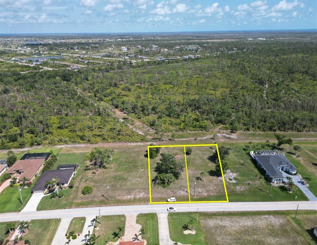 Photo of 1055 Boundary Boulevard, Rotonda West, FL 33947 (MLS # D6142615)
