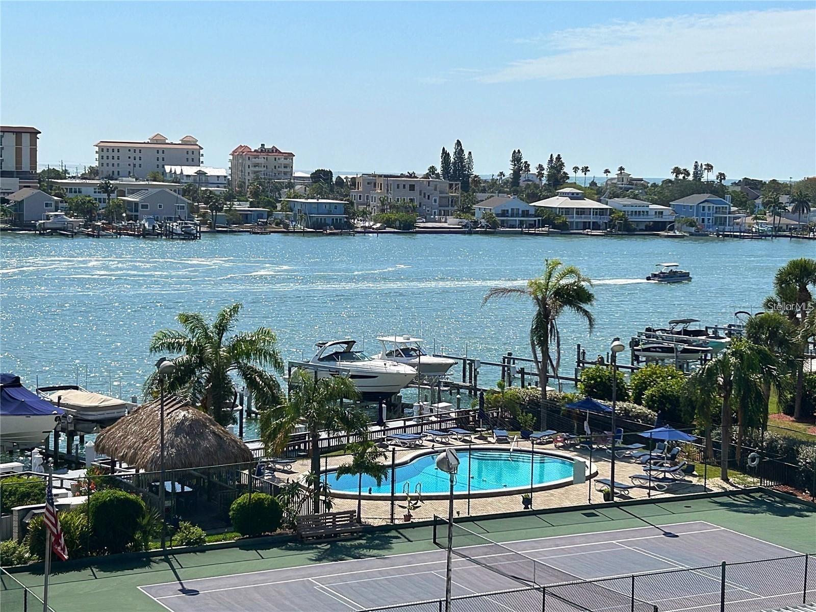 FULLY FURNISHED ISLAND ESTATES BEACH PARADISE- BEAUTIFUL WATER VIEWS & POOL VIEWS -AVAILABLE JANUARY 1ST FOR AN 8-12 MONTH LEASE OR FOR WINTER SEASON 2026 -COMPLETELY RENOVATED- 5TH FLOOR RESIDENCE VERY TASTEFULLY DECORATED WITH A BEACHY FLAIR- 2 BEDROOMS AND 2 FULL BATHS-OPEN CHEF'S DREAM KITCHEN WITH STAINLESS STEEL APPLIANCES-- NEWER FLOORING THROUGHOUT (NO CARPETING) COMES WITH COVERED PARKING SPACE #21- THIS BEAUTY IS LOCATED ON PRESTIGIOUS ISLAND ESTATES AT DIAMOND ISLE -SO MANY AMENITIES - TENNIS COURTS -NEWER TIKI HUT AND WATER FRONT HEATED POOL- KAYAK & BIKE STORAGE- FITNESS CENTER-SAUNA-BILLIARDS-PING PONG TABLE-WALK TO GROCERY STORE AND RESTAURANTS OR TAKE THE TROLLEY WHICH STOPS JUST STEPS FROM YOUR FRONT DOOR- PRICE REFLECTED IS FOR AN 8-12 MONTH LEASE- THIS BEAUTY WILL NOT LAST-JUST BRING YOUR CLOTHING AND TOOTHBRUSH- 13% TAX AND $350 CLEANING FEE APPLIES- ADVERTISED PRICE BASED ON A MINIMUM 8 MONTH LEASE - ALSO AVAILABLE FOR WINTER SEASON PLEASE INQUIRE ON PRICING FOR DESIRED MONTHS.