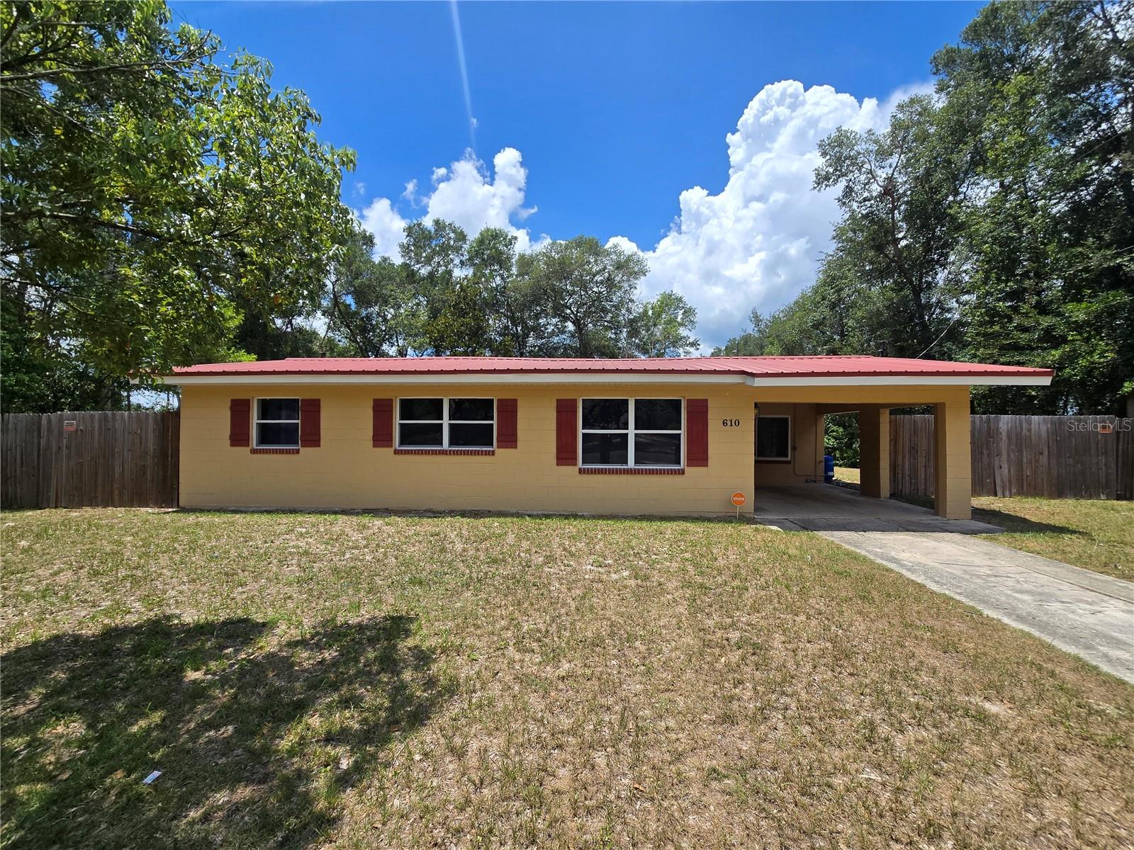 Welcome to this beautifully maintained 3-bedroom, 1-bath home situated on an oversized lot with plenty of room to enjoy outdoor living. The all-tile open floor plan offers a bright and airy layout, perfect for comfortable living and easy maintenance. Enjoy the added versatility of a Florida room—ideal for relaxing or entertaining. The property also features a one-car garage, a one-car carport, and a shed for additional storage. With no HOA, you have the freedom to make this home truly your own.