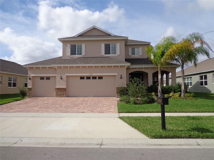 Absolutely Beautiful Two-Story single-family home with 3 car garage and 2587sq.ft. of living space. House features 4 bedrooms, 2.5 baths, Kitchen with granite countertops, Master bedroom downstairs, small loft located in 2nd level. Tile in common areas, all bedrooms have carpet. All kitchen appliances are included, as well as the washer and dryer. 

This Home is located at the community of Sawgrass Bay in Clermont.  Off Highway 27, approximately 9.5 miles away from Disney Maingate, very close to Wal-Mart Super Center, Lowes, post office, banks, restaurants, gas station, library and a lot of convenience stores.