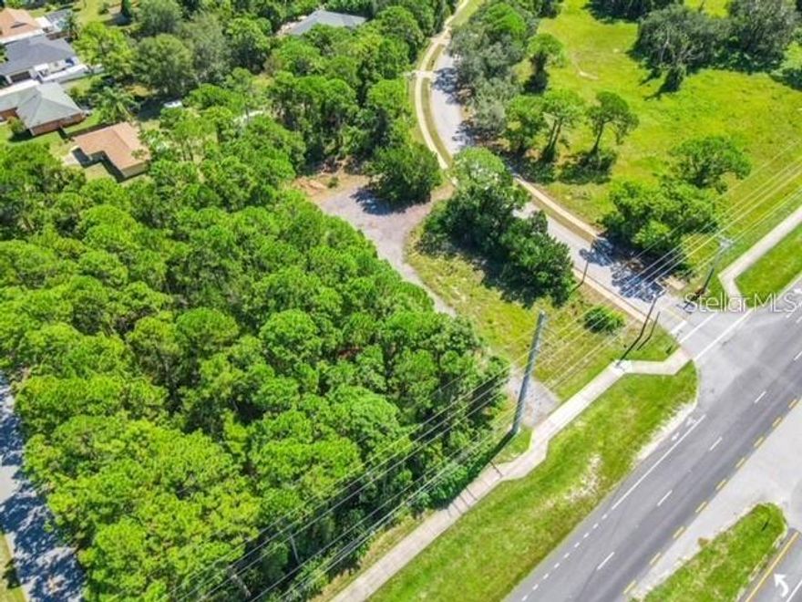 Don't miss this rare opportunity to own .69 acres of strategically located commercial land in Volusia county. Perfect for commercial visibility and exposure, this property offers main road frontage on S Ridgewood Ave, access to utilities, minutes away from New Smyrna Beach!
Excellent location. Corner lot on main road. Zoned B-4 General commercial classification and R-3 Urban single family residential. Land size approximate 100x300. Priced to sell. Offers welcomed!