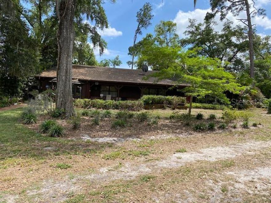 Don't miss the opportunity of making this home "Just what you've always wanted" with NO Homeowner Association and in a location of peace and tranquility.  This home sits on a 0.41 Acre Lot and consists of Kitchen, Dining and Living room, 2 Bedrooms, 2 1/2 baths, inside laundry, large office/den/library or Bonus room, over sized 2 C garage, besides a private 1bd/1ba, kitchenette, dining & living room In-law/Guest suite that has its own private entrance and separated by an enclosed breezeway from the main home. With no homeowner assoc. you can bring your RV, boat, trailer, or whatever you may need.  There is also a storage shed in rear of property.  Some of the uniqueness of the home is the tongue n' grove ceiling in some rooms..... This is certainly a home that you can add your own personal taste to and make it a "showplace"  This home is being sold "AS IS" and will require a Cash Buyer or Special Financing. Measurements of rooms and square footage of home are estimates only and should be verified.