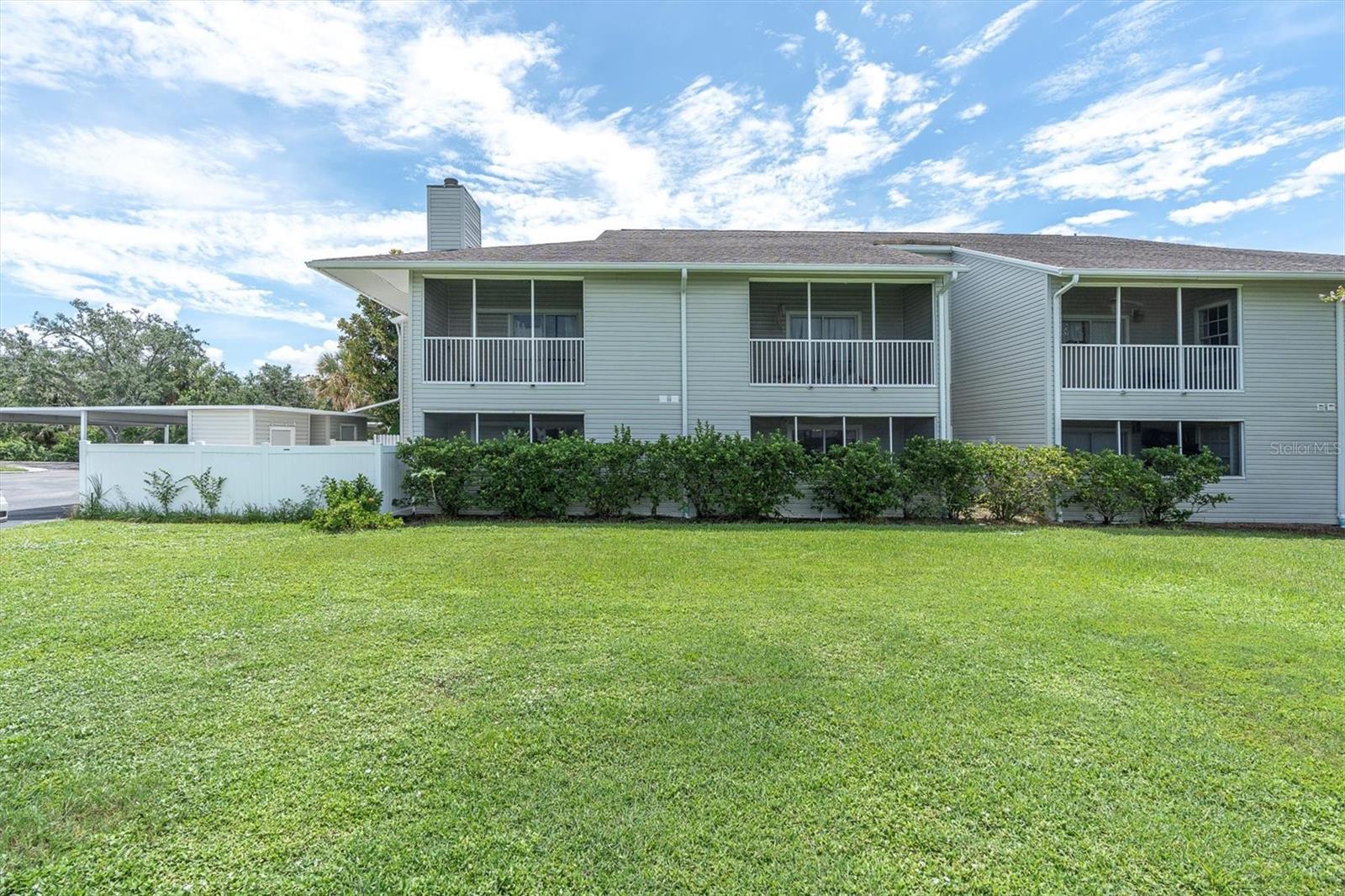 Welcome to Savannah Trace, your single-story maintenance free living at its finest. Sitting in a PRIME LOCATION, close to the Tampa Bay area beaches & extremely convenient to the Tampa International Airport. This 3 Bedroom, 2 Bath, corner unit home comes with 2 assigned parking spaces, one being a covered carport. This home has been newly updated and move in ready. Welcome inside your private courtyard, fenced for lots of privacy and makes a great place to sip your morning coffee, lots of room to entertain or to just relax and unwind. Expect to be wowed as you step inside, it's freshly painted with a beautiful neutral color and features wood look tile throughout the main living areas, new carpet in the bedrooms & crown molding in every room. The open living room is inviting with a cozy, wood-burning fireplace and sliding doors that lead to a private screened lanai. This is just one of the three patios you'll have to enjoy! The open concept flows nicely into the adjoining kitchen & dining area. This kitchen is a beauty, with stainless steel appliances, coordinating backsplash, Granite countertops, breakfast bar & a French door refrigerator. Your primary bedroom is spacious with a walk-in closet and ensuite bathroom that has an updated walk-in shower and grand-style vanity with LED mirror. The 2nd & 3rd bedrooms are equally impressive, both with access to their own screened lanai's. The guest bathroom has that wow factor with a beautifully tiled walk-in shower and luxury style vanity with LED lighted mirror! You'll find ceiling fans throughout, inside laundry with full size washer & dryer included and a private storage closet on the patio. Three private patios is such a rare find, this single-story end unit condo really does have it all! The community swimming pool is just steps away, making it easy to take a dip in the pool on these hot summer days. Savannah Trace has beautifully maintained grounds with lush landscaping and serene, peaceful ponds to enjoy. This is the one you've been waiting for, give me a call to schedule your private showing today.