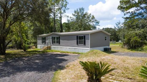 Photo of 2705 Sandlewood Lane, Bunnell, FL 32110 (MLS # FC312478)