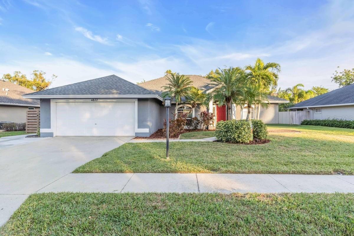 Welcome to Grove Pointe, a desirable single-family home neighborhood centrally located in Sarasota, Florida. This thoughtfully updated and well-maintained 3/2 pool home, built in 1998, features 1811 square feet of living space. Upon arrival you'll notice the oversized driveway with a sidewalk leading to the fenced yard through a gate and another walkway to the front door. Once you step through the front door, you will see an open - split floor plan, featuring a triple slider from the living room out to the expansive back patio and pool area. The living room is open to the dedicated dining space and the remodeled kitchen (2019). The kitchen features updated white shaker cabinets, granite countertops, and a large island featuring a farmhouse sink and room for three to comfortably sit. Located next to the kitchen is the dinette, which also features sliders out to the patio and pool area. The dinette also leads to two carpeted bedrooms and a bathroom. The primary bedroom is located on the opposite side of the home, with sliders that lead out to the oversized back patio/pool area. The primary bedroom comes with a custom built in closet with lightning . The primary bathroom has a separate water closet/toilet area, garden tub, shower, vanity area, and window for natural light. Enjoy your evenings sitting under the covered back patio featuring brick pavers or your days lounging next to the oversized pool. The oversized patio and pool area is the perfect extension of the living space and provides an ideal area for relaxation or hosting gatherings. Upgrades: Kitchen Remodel 2019, New Variable Speed Pool Pump 2022, AC 2021, Roof 2021, Water Heater 2017. Close to Siesta Key, Lido, St. Armand’s, and other area beaches, Shopping, UTC, Schools, Parks, Ed Smith Stadium, I-75, Lakewood Ranch, and much more. Contact me today to see this beautiful home.