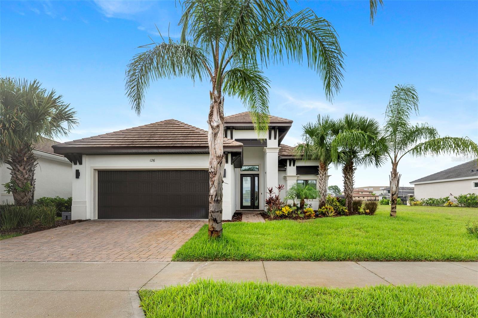 This beautifully upgraded Saltwater Homes “Riva” model is move-in ready and waiting for you in the exclusive Marina Del Palma Yacht Club. The home features 3 bedrooms, 2.5 bathrooms, and a flexible study with double doors that can also be used as a 4th bedroom.
The home has been freshly painted, has brand new bedroom flooring, and the tile roof was just power-washed. You’ll love the open layout that connects the great room, kitchen, and dining area—perfect for everyday living and entertaining.
The kitchen includes a large island, quartz countertops, shaker-style cabinets, and high-end Thor stainless appliances with a gas range. A beautiful Champagne Creekstone accent wall with a multicolor electric fireplace adds style and warmth to the living space.
Triple sliding glass doors open to a covered lanai with peaceful lake and fountain views. Best of all, the lanai comes fully equipped with a built-in summer kitchen, perfect for enjoying the Florida indoor-outdoor lifestyle.
Marina Del Palma is a gated, resort-style community offering 154 homesites. Each site includes a private dry boat slip within the state-of-the-art boathouse, along with valet boat service—simply click the app to have your boat ready when you arrive! Community amenities also include a beautifully designed clubhouse with pool, fitness center, tennis courts, and dog park.
Located just minutes from Flagler Beach, and close to restaurants, trails, shopping and everything Palm Coast has to offer—this home combines luxury, convenience, and coastal elegance.
Don’t wait—this home won’t stay on the market long. Come see it today!