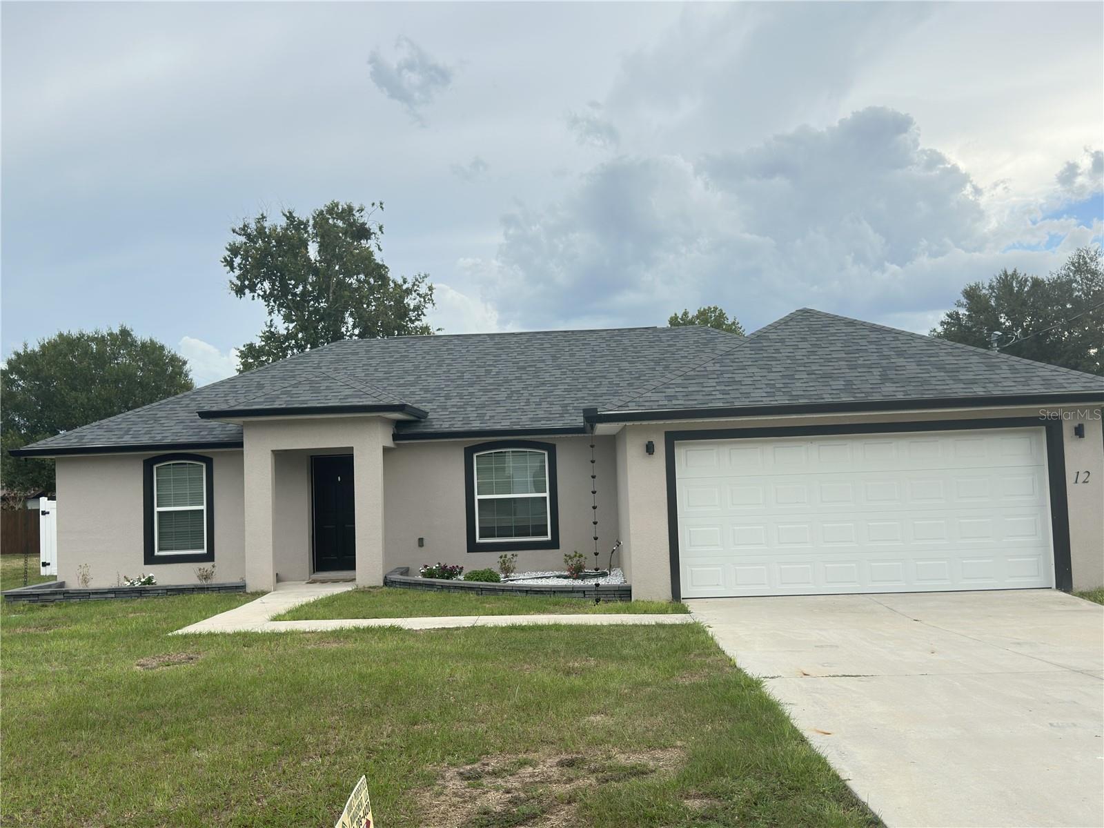 One or more photo(s) has been virtually staged. Like new and with an open floor concept plan is a 3 bedroom/ 2 bath one story home. Built in 2022 with a 2 car garage and a huge yard with enclosed lanai and extra sense of privacy! Located in the Silver Springs Shores close to all amenities you could need for shopping, groceries, restaurants, etc. Upgrades include gutters, water softener system, granite countertops, tile all throughout. This home is ready.