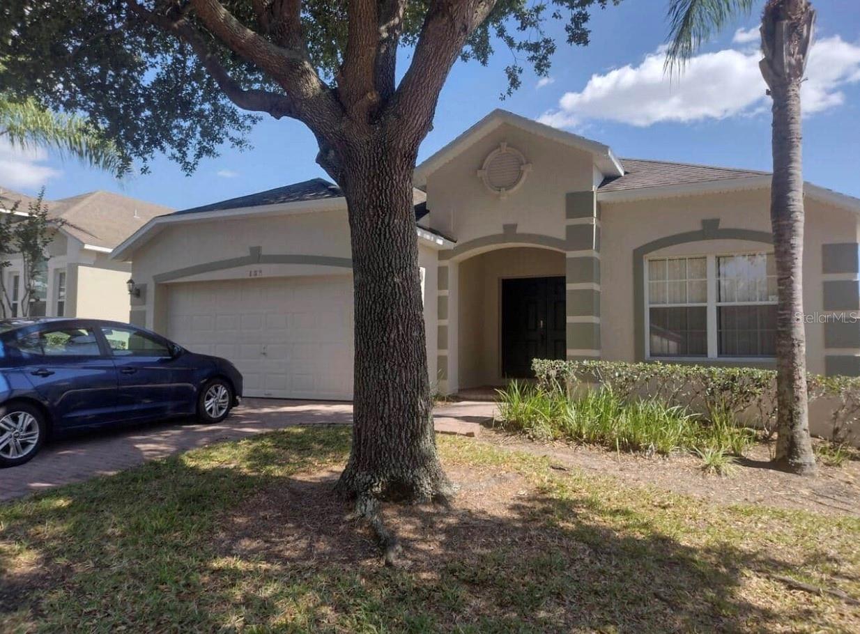 Welcome to this fully furnished 4-bedroom, 3-bathroom home located in the gated community of Highgate Park at Legacy Park. This property is zoned for both short-term rental and residential living, making it an excellent income-producing opportunity or vacation retreat. The home features a spacious, open floor plan designed for comfort, with a bright living area flowing into the dining space and fully equipped kitchen. The garage has been converted into a games room, providing additional entertainment to attract renters. Two Master Bedrooms/ensuites. The primary suite offers direct pool access, two walk-in closets, and an ensuite with double sinks, a garden tub, a large tiled shower, and a private water closet. The outdoor space is a highlight, with an oversized pool, spa, extended deck, lanai, and screened enclosure. Community amenities include a playground and tennis courts, and the home is conveniently located near shopping, dining, major routes, and all of Central Florida’s attractions including Disney. This is move-in ready home and a seamless investment opportunity.