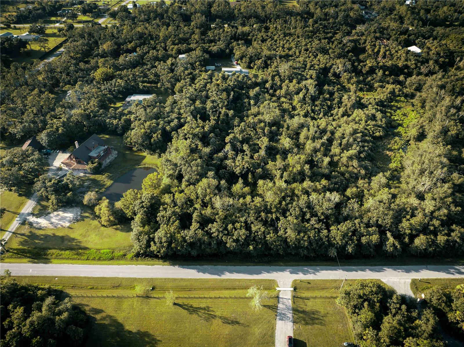 Build your dream retreat on this stunning 3.03-acre wooded lot in the sought-after North Port Estates! Towering palms and natural beauty offer the perfect backdrop for your future home. Zoned for agriculture, this property welcomes horses and is near scenic riding trails. Enjoy the peace of country-style living while staying just minutes from I-75, top-rated schools, shopping, dining, and the new North Port Water Park. Spend weekends at CoolToday Park cheering on the Atlanta Braves, then explore all that Downtown Wellen Park has to offer — from live music to boutique shopping and dining. And don’t forget those breathtaking Gulf Coast sunsets just a short drive away. Schedule your showing today!