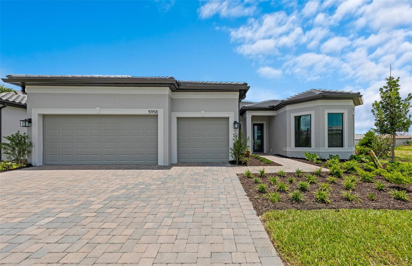 Available now, new construction! Welcome to this beautifully upgraded Stellar floor plan, offering 3 spacious bedrooms, 3 full bathrooms, a versatile den, and a 3-car garage. This home is designed with comfort, elegance, and functionality in mind. The heart of the home is the gourmet kitchen, featuring quartz countertops, an oversized pantry, and an open layout that flows seamlessly into the large gathering area – perfect for entertaining guests. High ceilings and a tray ceiling in the gathering room add an extra touch of sophistication. The owner’s suite is truly a retreat, complete with a tray ceiling, a massive walk-in closet, and an oversized en suite bath with an extended walk-in shower. One of the secondary bedrooms also features a private en suite, ideal for guests or multi-generational living. Additional upgrades include zero corner sliders that blur the line between indoor and outdoor living, and a fully updated laundry room with cabinets, a sink, and countertops. Nestled in the esteemed Palmer Ranch area, Talon Preserve is a gated community offering a resort lifestyle with open floor plans, gourmet kitchens, and large outdoor living spaces. For those looking for resort lifestyle communities with private amenities and modern houses, or luxury homes for sale in Nokomis, FL, Talon Preserve should be your top choice. Neighborhood features include 18,000 sq. ft. Grand clubhouse with large community room for events, catering kitchen, social lounge, outdoor lounge, card-craft room and classic arcade room, State-of-the-art fitness center, performance training room and group fitness studio, 8 Pickleball courts, 2 Tennis courts, 4 Bocce courts, playground, firepit lounge, dog park, resort style pool, heated spa, splash pad, full-service restaurant bar & grill, & more!