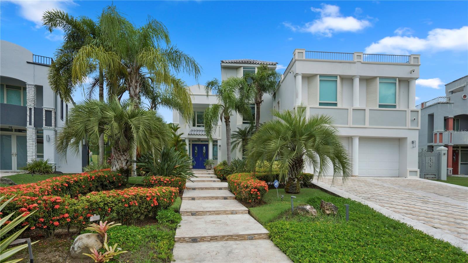 Ready to Move and Impeccable Home In Caguas Real!
Conveniently located within the serene confines of Caguas Real Home Resort, this imposing property epitomizes luxury living in the heart of Caguas, Puerto Rico. Offering a prime location adjacent to the recognized Caguas Real Golf Course & Country Club, the Four Point by Sheraton, and HWY 52, residents enjoy unparalleled convenience and leisure options. This distinguished residence features four spacious bedrooms, three full bathrooms, and two half baths, complemented by a formal dining area, family room with high ceilings, and a sleek open-concept kitchen, complete with built-in ovens, a pantry, a built-in bar and a wine cooler, perfect for hosting gatherings or enjoying quiet family meals. With a gross living area of 3811 ft2, including marble floors throughout, the home exudes elegance at every turn. The laundry room offers convenience, while the heated pool invites year-round relaxation.
Unique to this property is its exclusive positioning within the community, as the only home not facing another house, ensuring privacy and unobstructed views. Residents also enjoy access to a retention pond, further enhancing the natural beauty of the surroundings. For eco-friendly energy independence, the house boasts a 12 KW solar system with 26 panels and a Tesla battery, while a 27kw gas generator and 250 LP Gas tanks provide redundant power sources. Smart Alexa integration controls lighting and sound effortlessly, while central AC with UV filters ensures comfort year-round. Security is paramount with a comprehensive camera system, and a 600-gallon water cistern ensures reliability. Connectivity is seamless with a redundant 9-hub Google Mesh system and LAN setup. Experience the epitome of contemporary living amidst the tranquility of Caguas Real Home Resort.
Caguas Real Home Resort is the most sought-after neighborhood on Caguas right now!